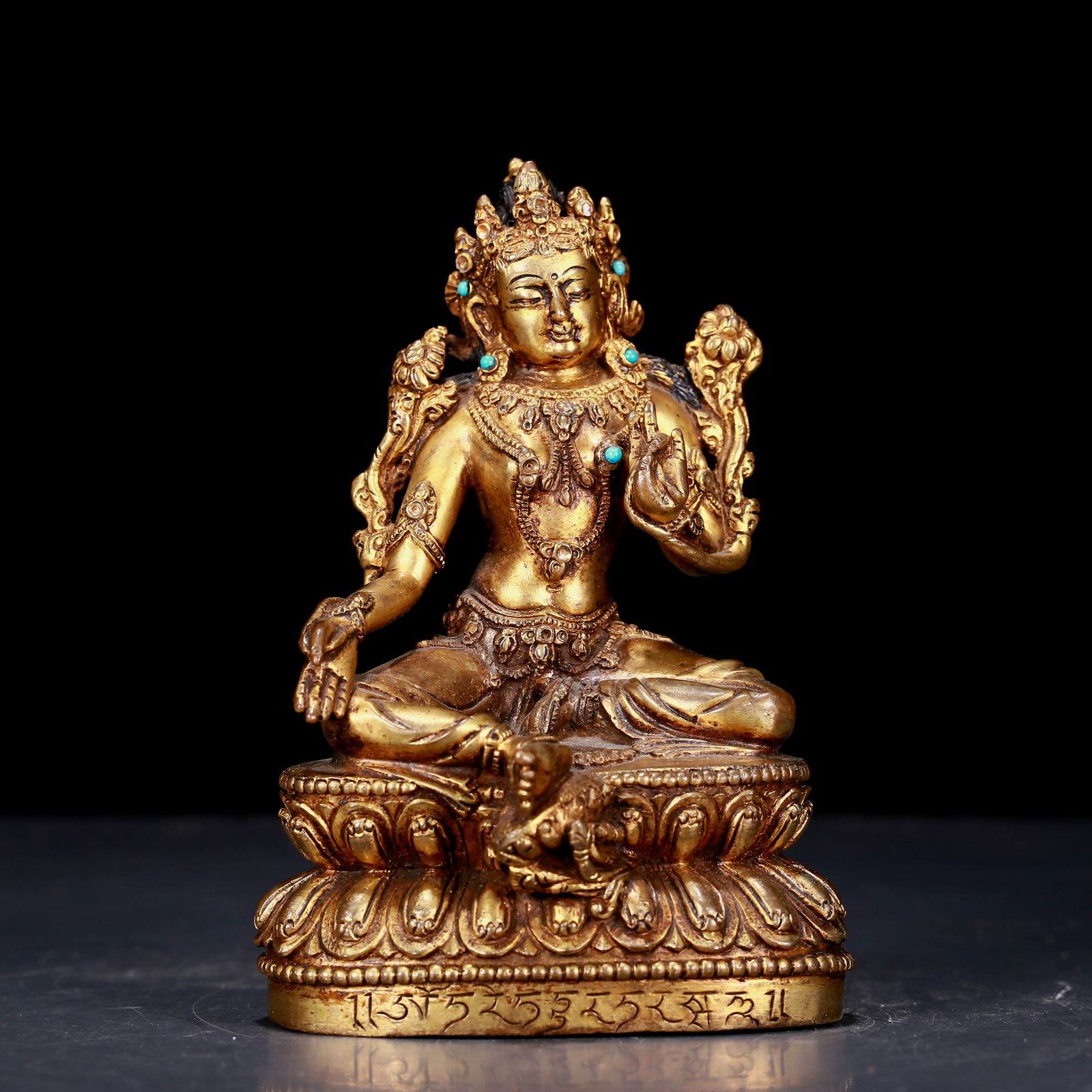 An exquisite gilt bronze statue of Tara: An exquisite gilt bronze statue of Tara, from the Ming Dynasty in China. Tara has an elegant posture with a peaceful and compassionate expression. Her face is soft and solemn, and her eyes are warm.