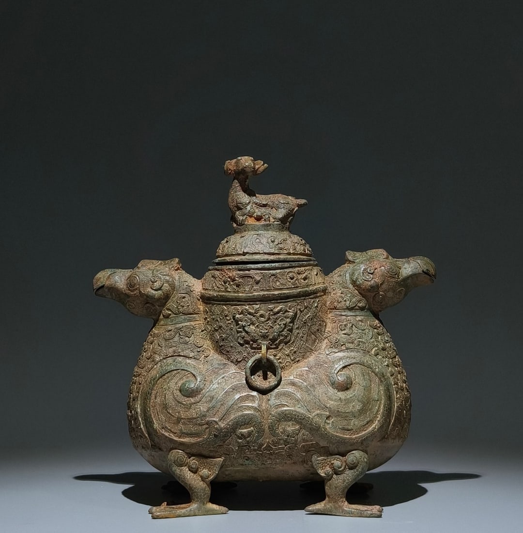 An Archaic Bronze Coiling Dragon Pattern Bird-Shaped Zun (1 of 9)
