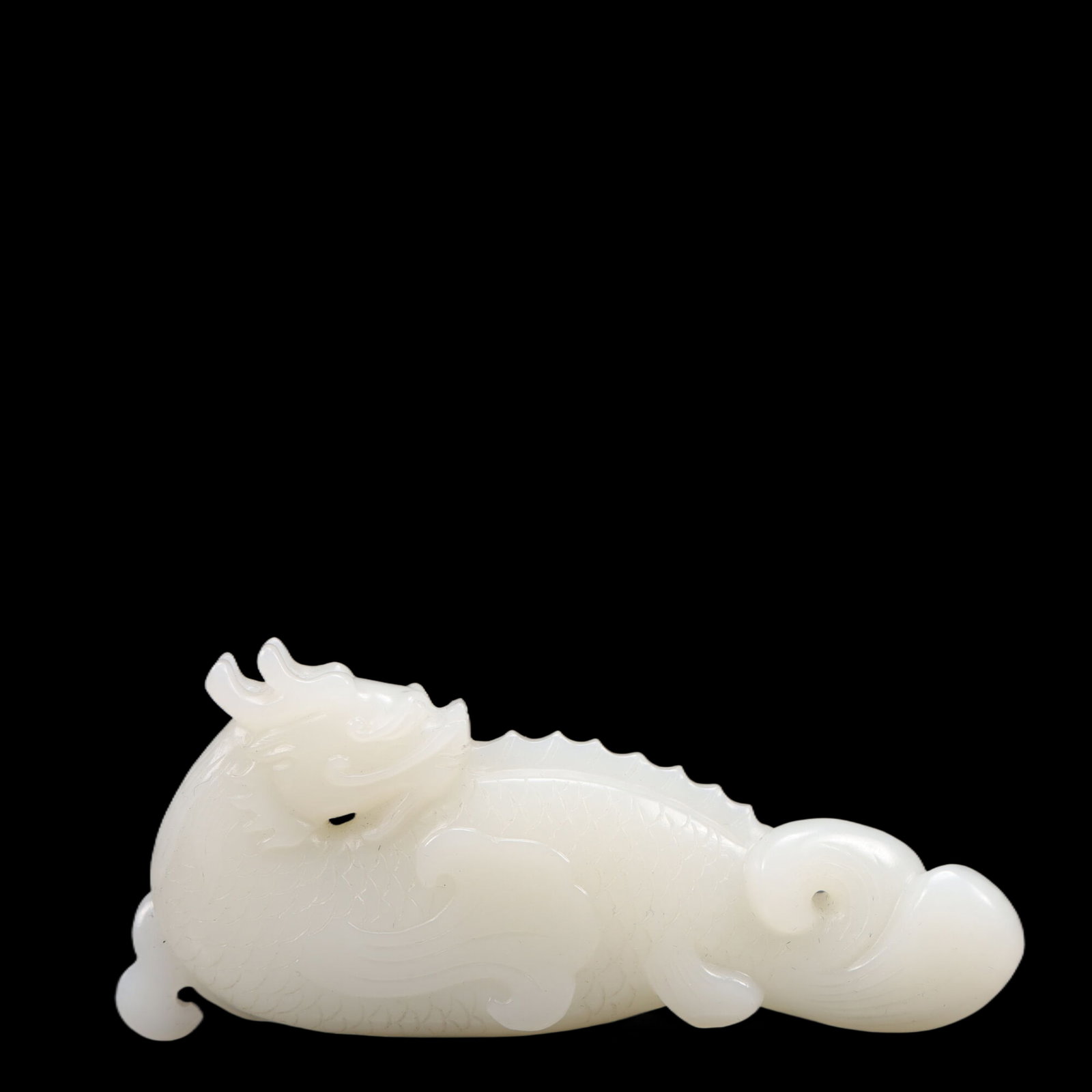 An Exquisite White Jade Dragon Ornament (1 of 4)