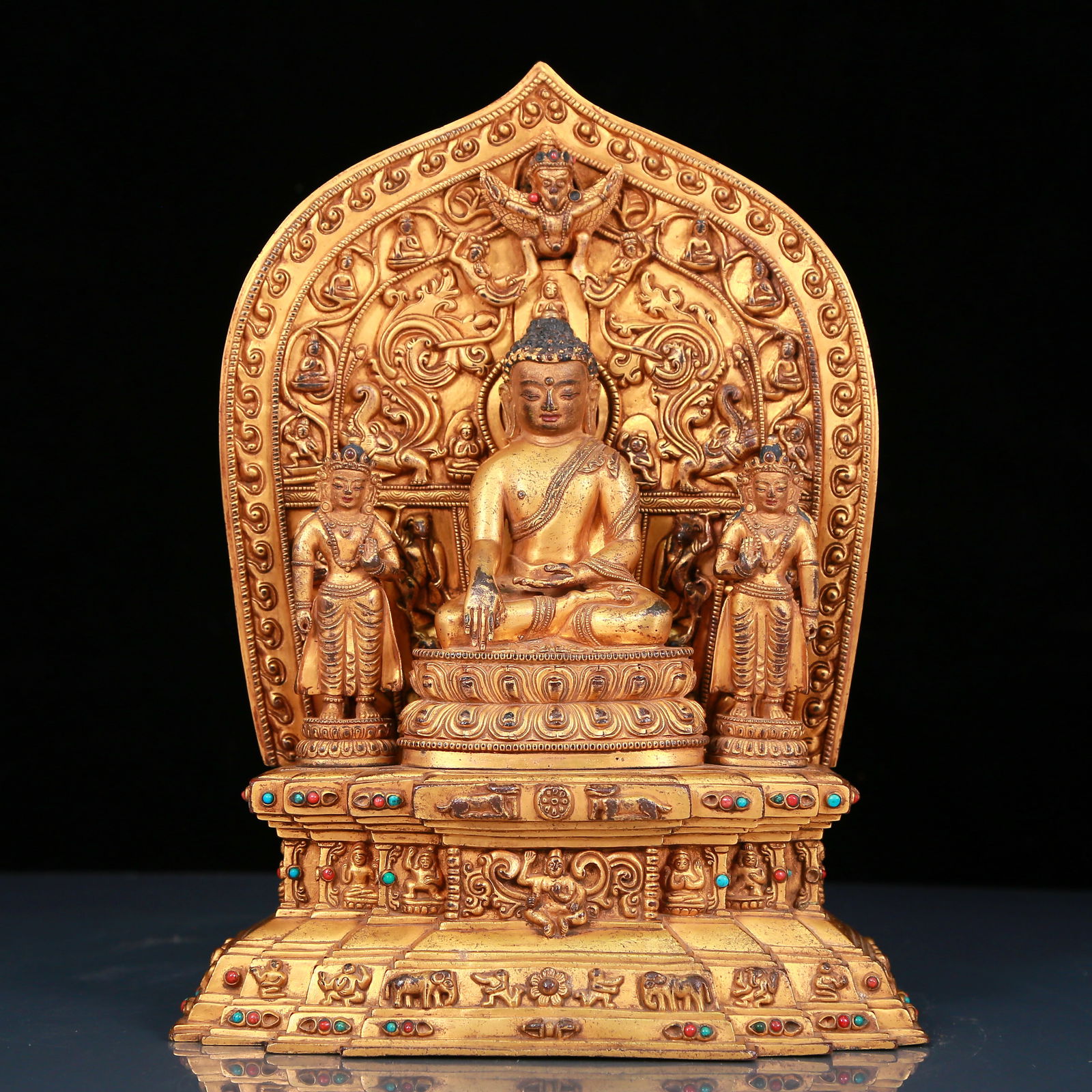 A solemn gilt bronze statue of Gautama Buddha inlaid with precious stones (1 of 9)