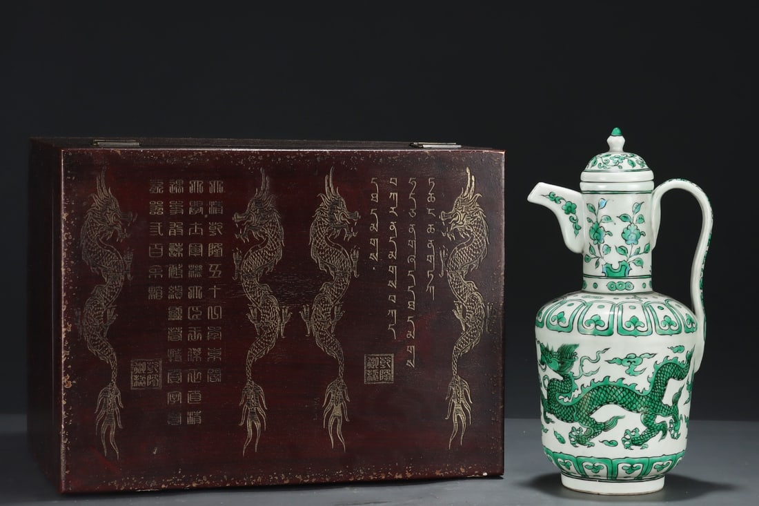 A Rare Green Color Auspicious Cloud and Dragon Pattern Ewer: A Rare Green Color Auspicious Cloud and Dragon Pattern Ewer,Ming Dynasty, China,Xuande Six-character Mark,Size:15.2inx7.9in 绿彩祥云龙纹执壶,中