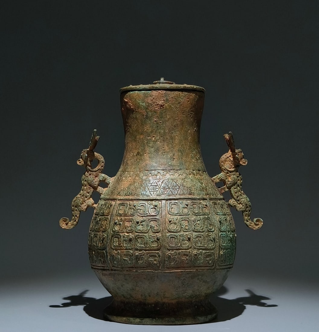 An Archaic Bronze Chi-Dragon Pattern Beast-Ears Pot,With Inscription (1 of 9)