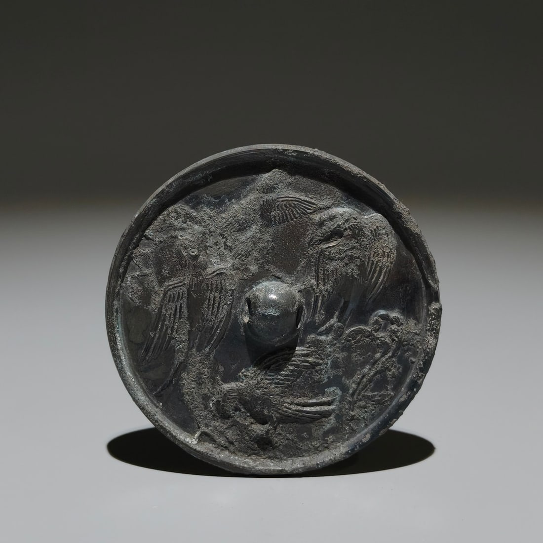 An Archaic Bronze Bird Pattern Round Mirror: An Archaic Bronze Bird Pattern Round Mirror,Tang Dynasty, China,Size:3.5in 青铜鸟纹圆镜,中国唐代
