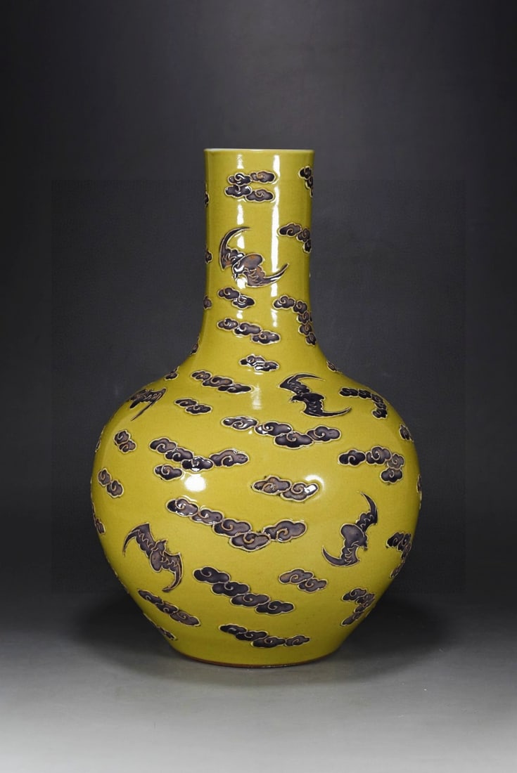 A Rare Yellow Glazed Paste relief Auspicious Cloud and Bats Pattern Vase: A Rare Yellow Glazed Paste relief Auspicious Cloud and Bats Pattern Vase,Qing Dynasty, China,Size:13.8inx9.1in 黄釉沥粉祥云蝙蝠纹瓶,中