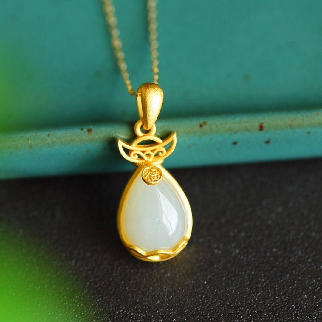 An Exquisite Sterling Silver-Gold Plated Inlaid White Jade Pendant: An Exquisite Sterling Silver-Gold Plated Inlaid White Jade Pendant 纯银镀金镶白玉吊坠