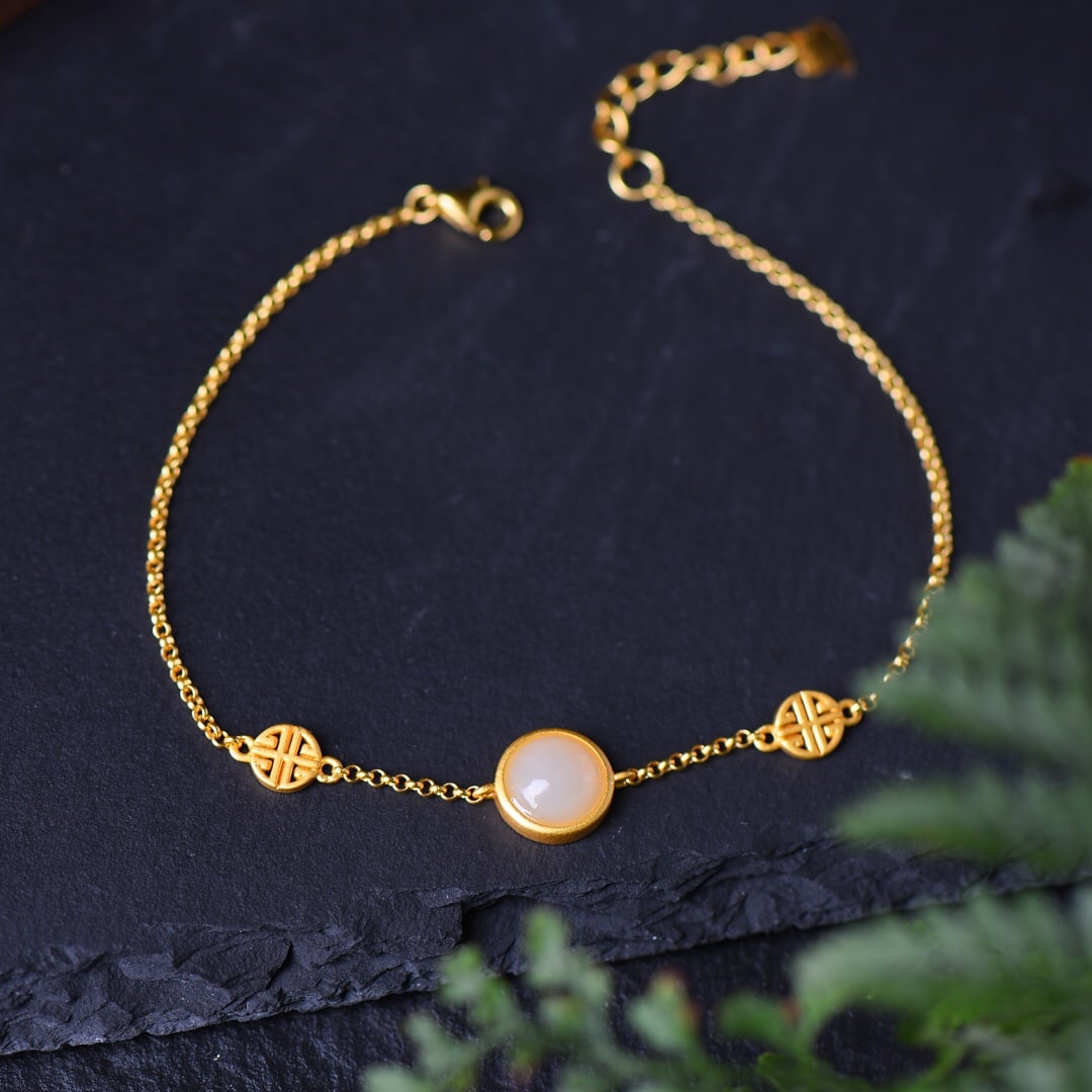 An Exquisite Sterling Silver-Gold Plated Inlaid White Jade Bracelet: An Exquisite Sterling Silver-Gold Plated Inlaid White Jade Bracelet,Size:8mmx8mm 纯银镀金镶白玉手链
