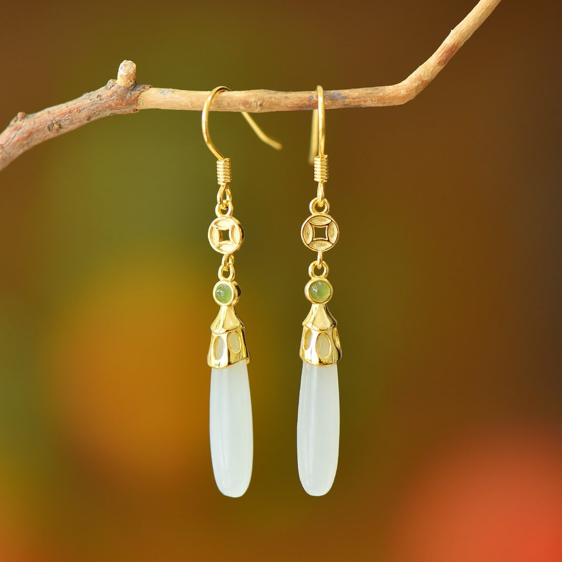 A Pair of Exquisite Sterling Silver-Gold Plated Inlaid White Jade Earrings: A Pair of Exquisite Sterling Silver-Gold Plated Inlaid White Jade Earrings,Size:5mmx20mm 一对纯银镀金镶白玉耳环