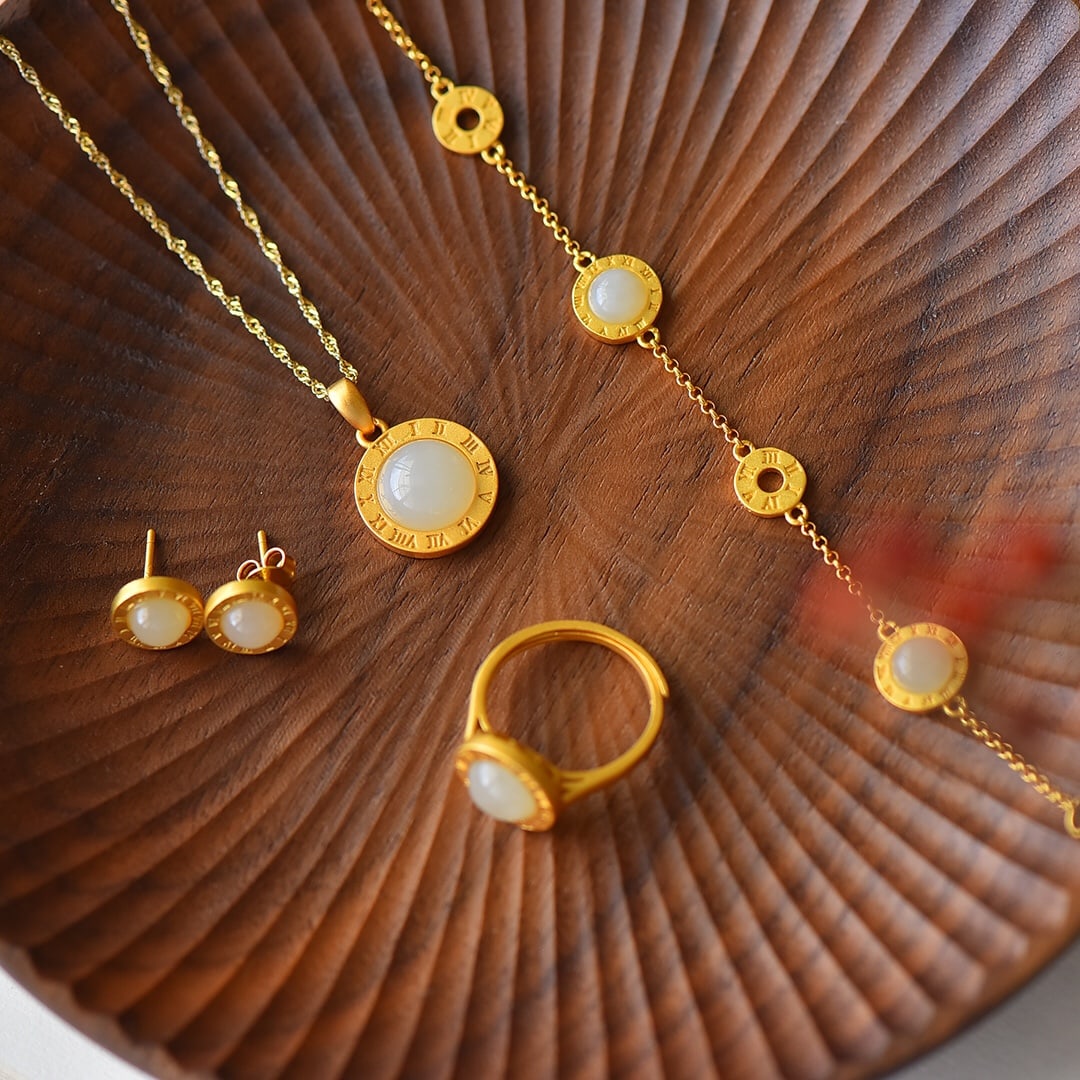 A Set of Fine Sterling Silver-Gold Plated Inlaid White Jade Jewelrys: A Set of Fine Sterling Silver-Gold Plated Inlaid White Jade Jewelrys,Size:(Pendant)10mmx10mm,(Earrings)6mmx6mm,(Bracelet)6mmx6mm,(Ring)8mmx8mm 