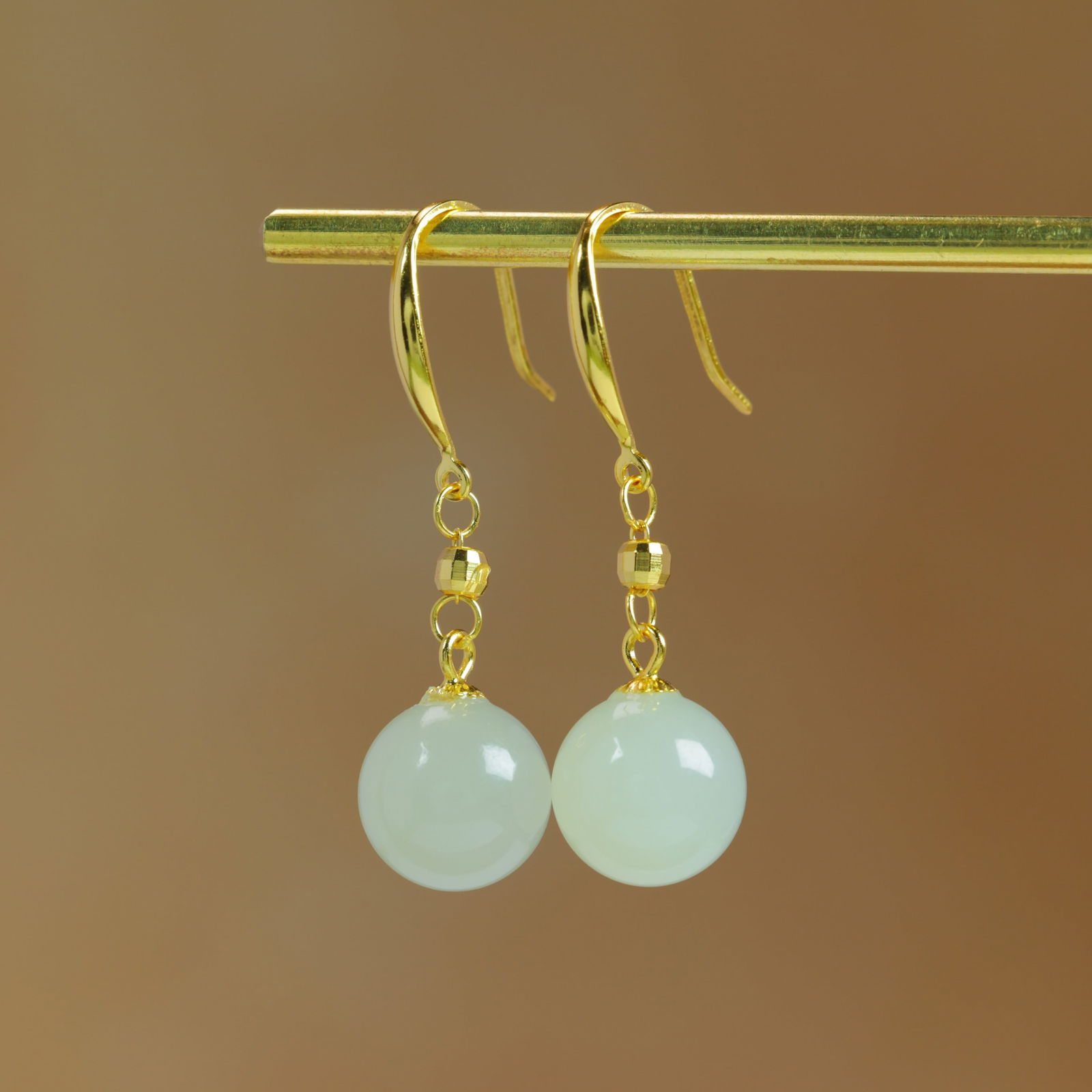 A Pair of Exquisite Sterling Silver-Gold Plated Inlaid White Jade Earrings: A Pair of Sterling Silver-Gold Plated Inlaid White Jade Earrings , Size :10mmx10mms 