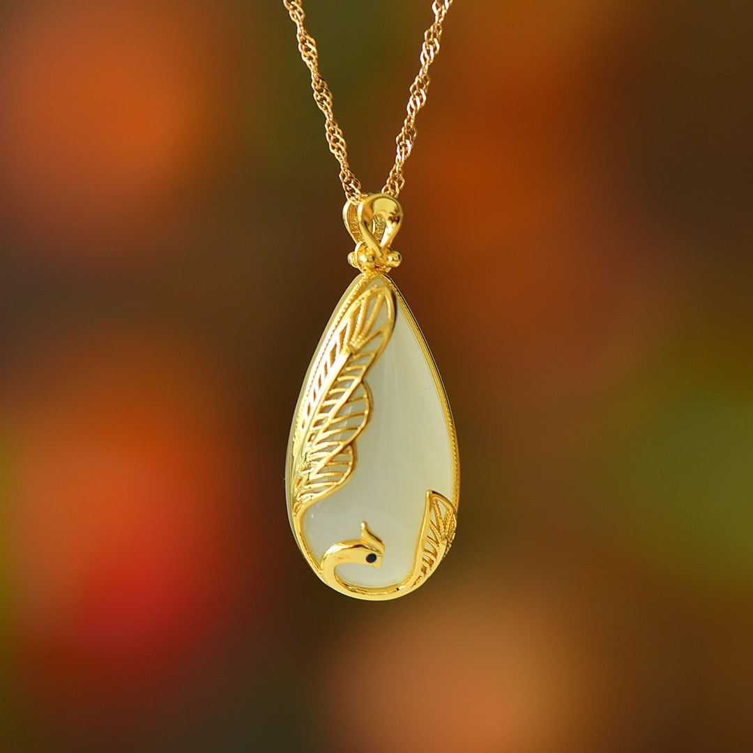 An Exquisite Sterling Silver-Gold Plated Inlaid White Jade Pendant: An Exquisite Sterling Silver-Gold Plated Inlaid White Jade Pendant,Size:13mmx25mm 纯银镀金镶白玉吊坠