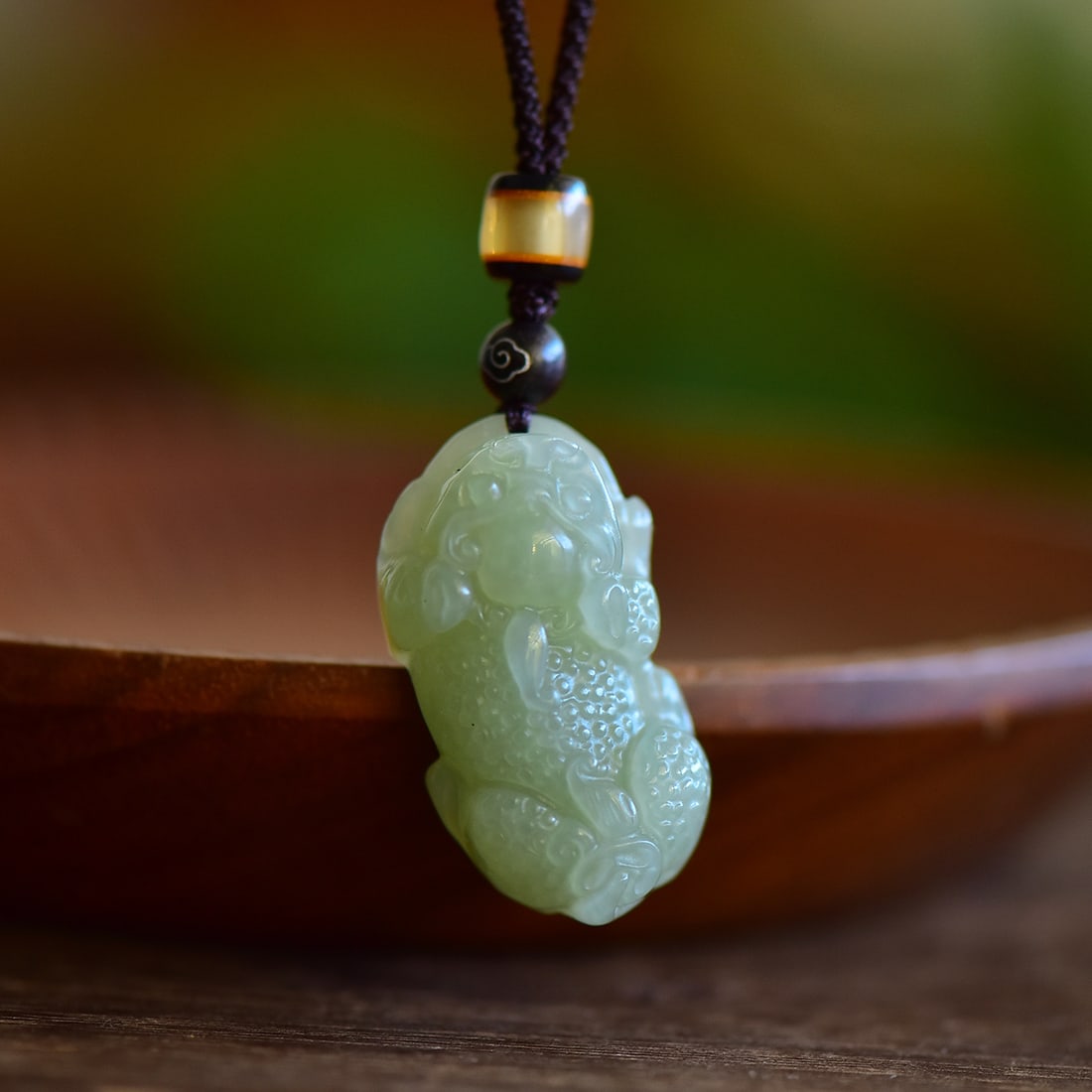 An Exquisite Greenish Jade Auspicious Beast Pendant: An Exquisite Greenish Jade Auspicious Beast Pendant,Size:39mmx20mm 寓意:天地守护,吉祥如意,辟邪护佑 