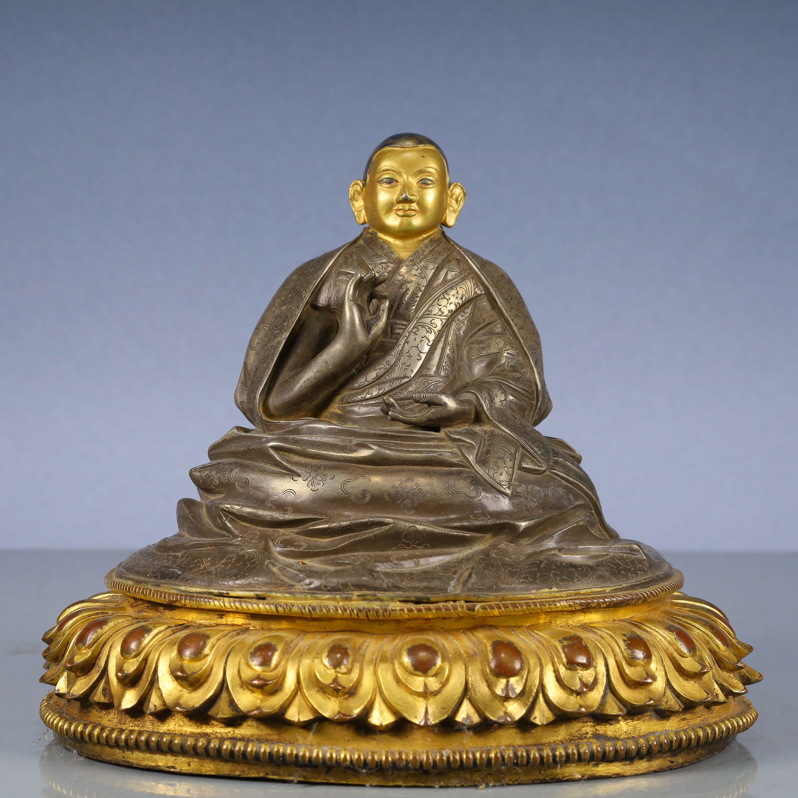 A Solemn Bronze Inlaid Gold and Silver Statue of Guru: A Solemn Bronze Inlaid Gold and Silver Statue of Guru,Qing Dynasty, China,Size:8.3inx7.1inx7.1in,Weight:2800g 铜嵌金银上师像,中国清代