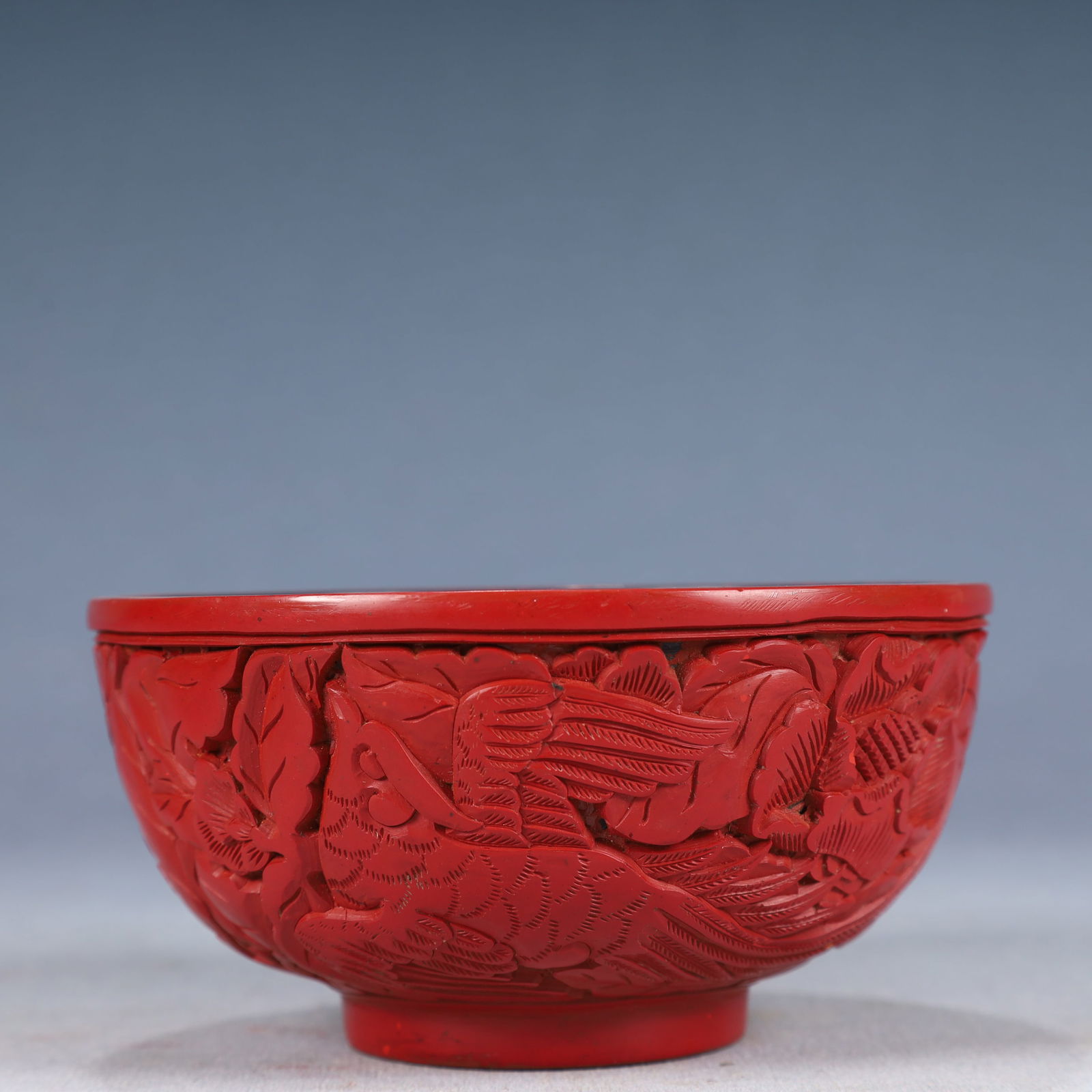 An Exquisite Carved Red Lacquer Flower and Bird Pattern Bowl: An Exquisite Carved Red Lacquer Flower and Bird Pattern Bowl,Qing Dynasty, China,Size:5.1inx2.6in,Weight:150g 剔红漆花鸟纹碗,中国清代