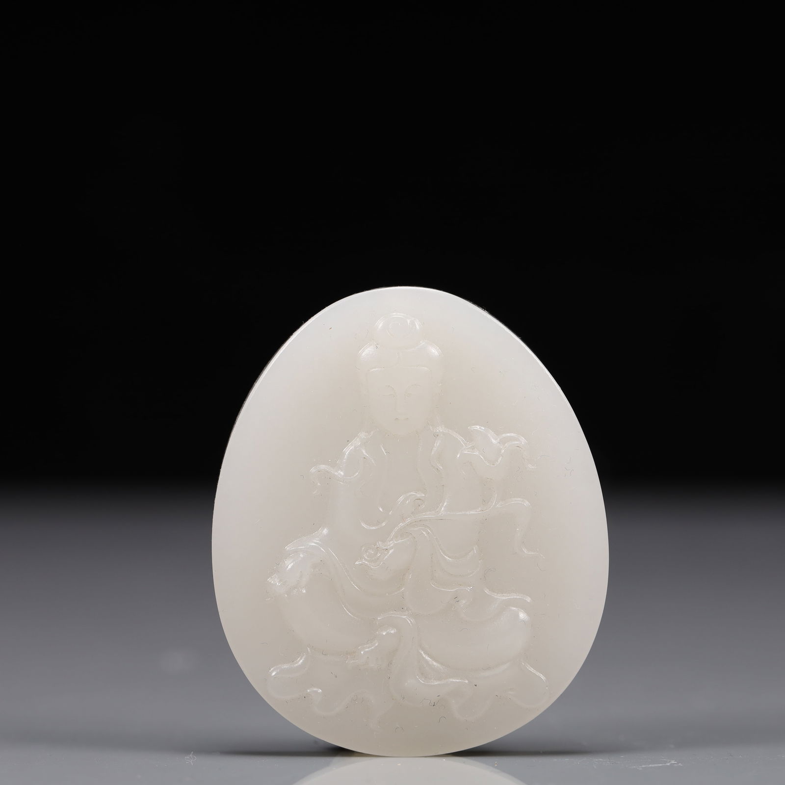 An Exquisite White Jade Statue of Avalokitesvara Pendant: An Exquisite White Jade Statue of Avalokitesvara Pendant, Qing Dynasty, China, Size:1.9inx0.3inx2.2in, Weight:47g 