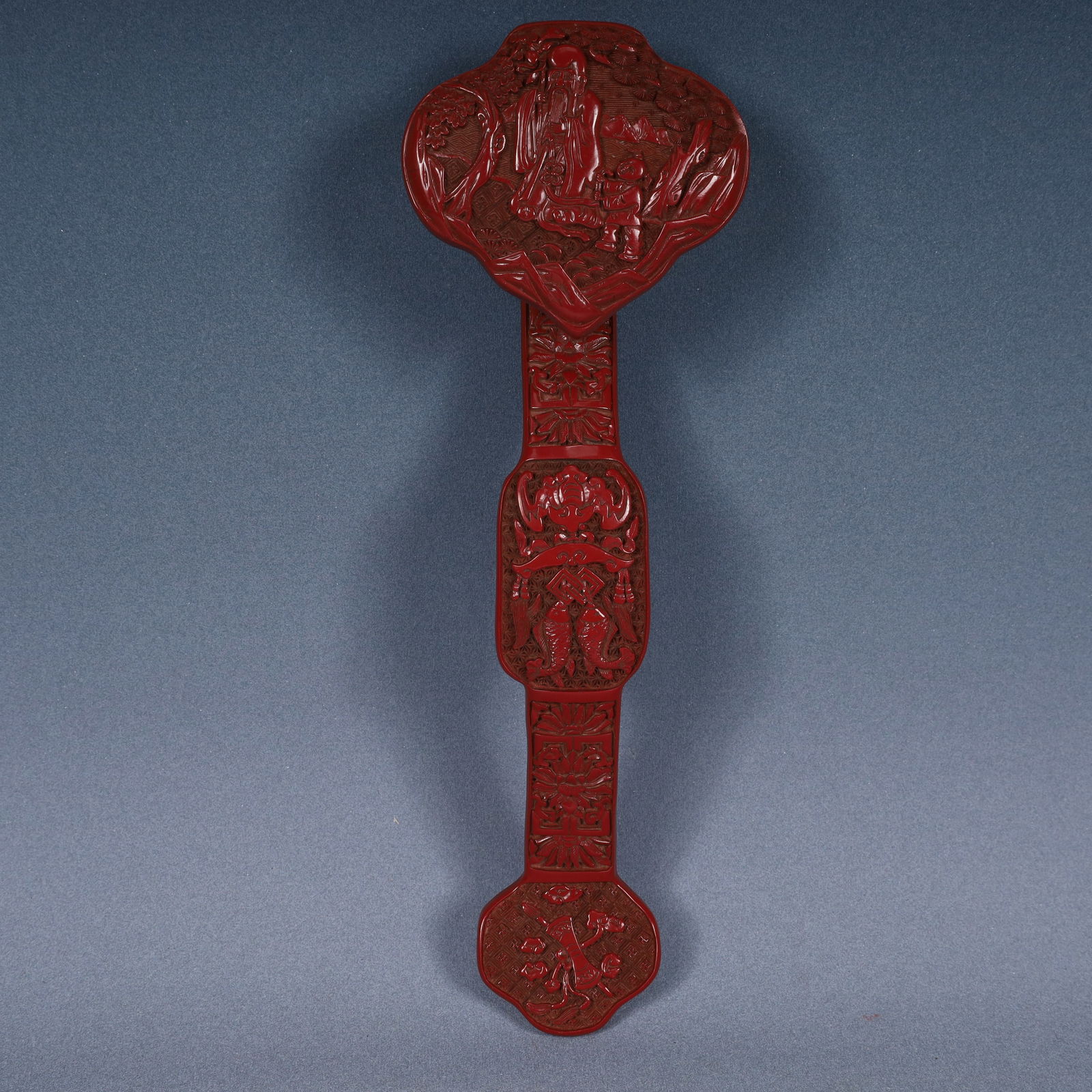 A Rare Carved Red Lacquer Lotus and Figure Pattern Ruyi (1 of 14)