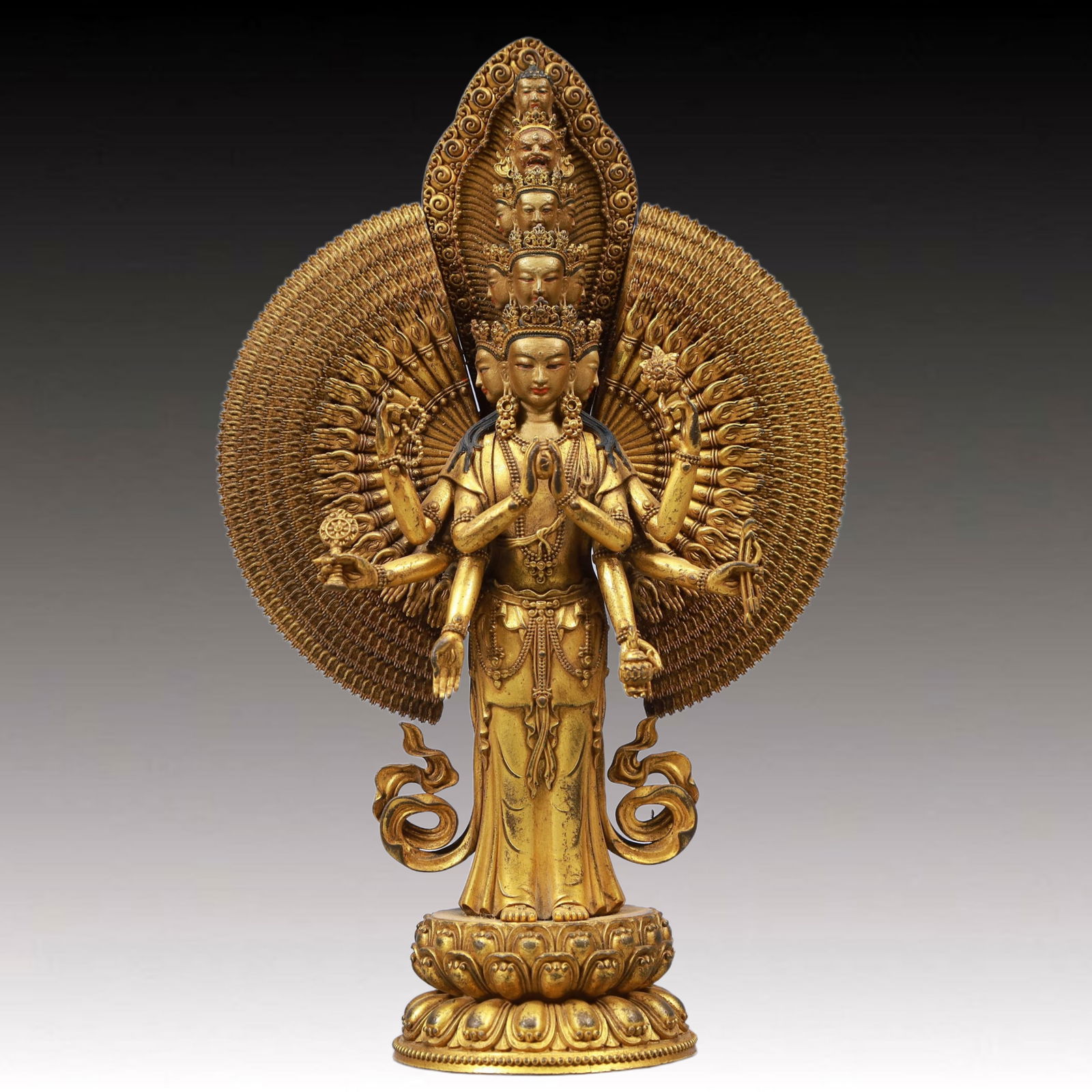 A Solemn Gilt Bronze Statue of Thousand-hand Guanyin: A Solemn Gilt Bronze Statue of Thousand-hand Guanyin, Qing Dynasty, China, Size:5.9inx2.8inx7.9in, Weight:1300g 铜鎏金千手观音像,中国清