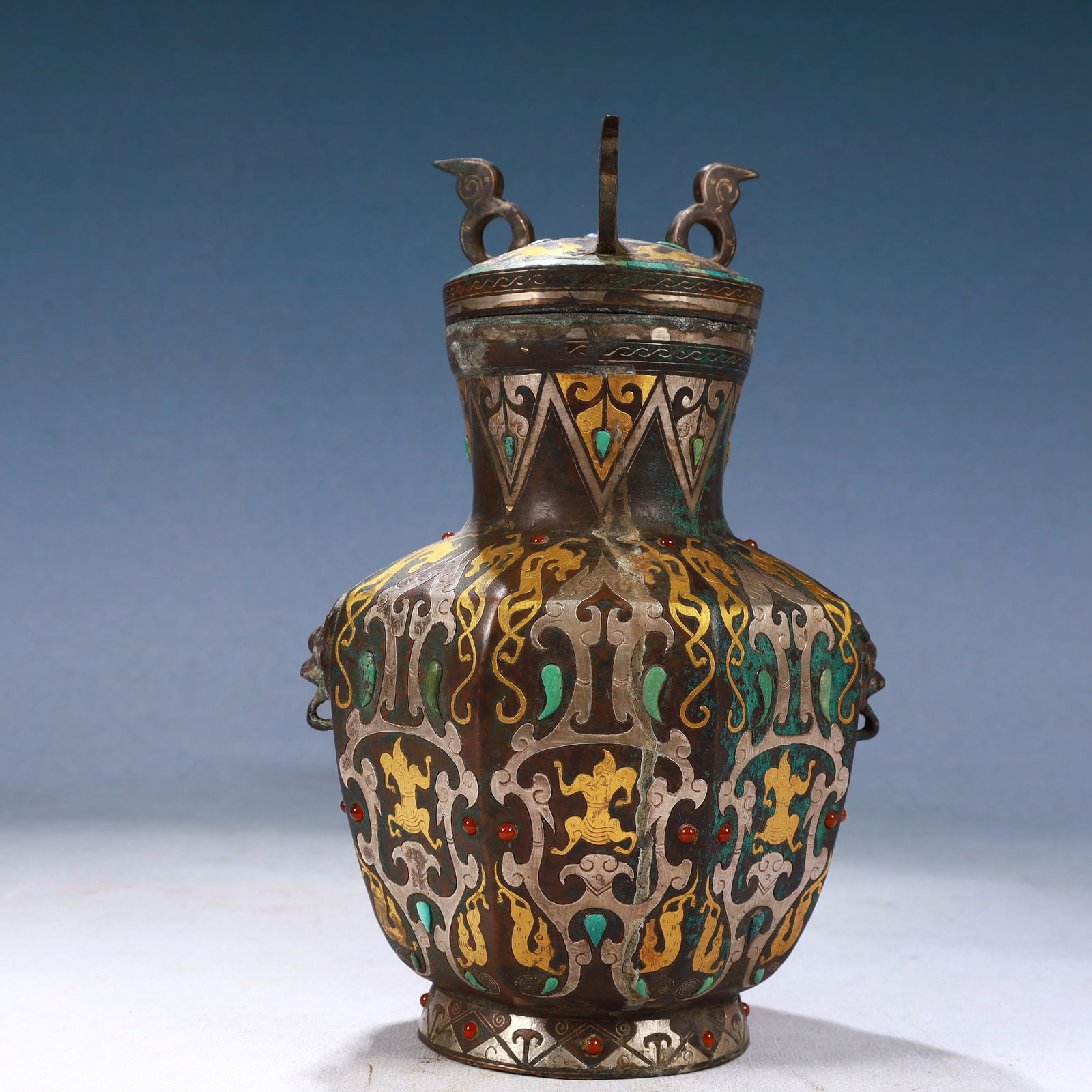 An Exquisite Bronze Inlaid Gold and Silver Auspicious Beast Pattern Beast-Ears Bottle (1 of 10)