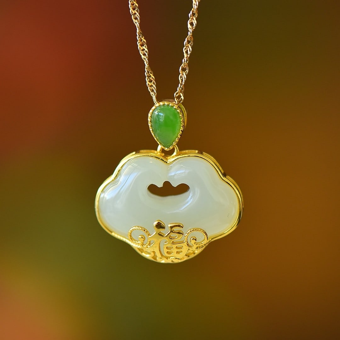 An Exquisite Sterling Silver-Gold Plated Inlaid White Jade Pendant: An Exquisite Sterling Silver-Gold Plated Inlaid White Jade Pendant,Size:0.6inx0.8in 纯银镀金镶白玉吊坠