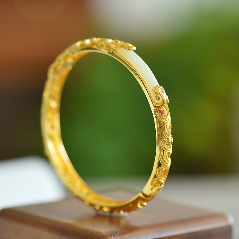 An Exquisite Sterling Silver-Gold Plated Inlaid White Jade Bracelet: An Exquisite Sterling Silver-Gold Plated Inlaid White Jade Bracelet 纯银镀金镶白玉手镯