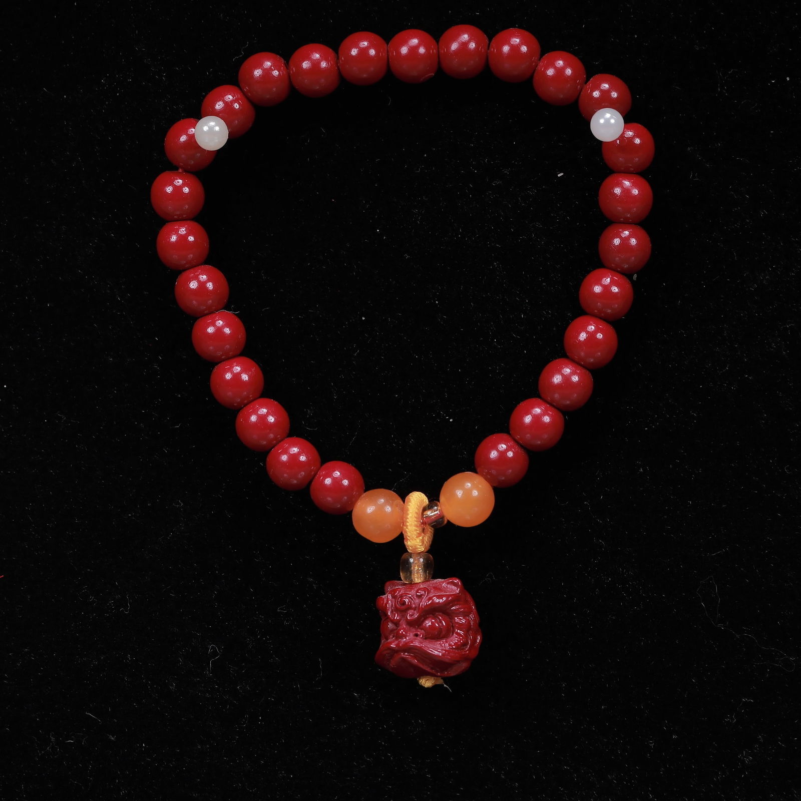 An Exquisite Cinnabar Auspicious Beast Bracelets (1 of 5)
