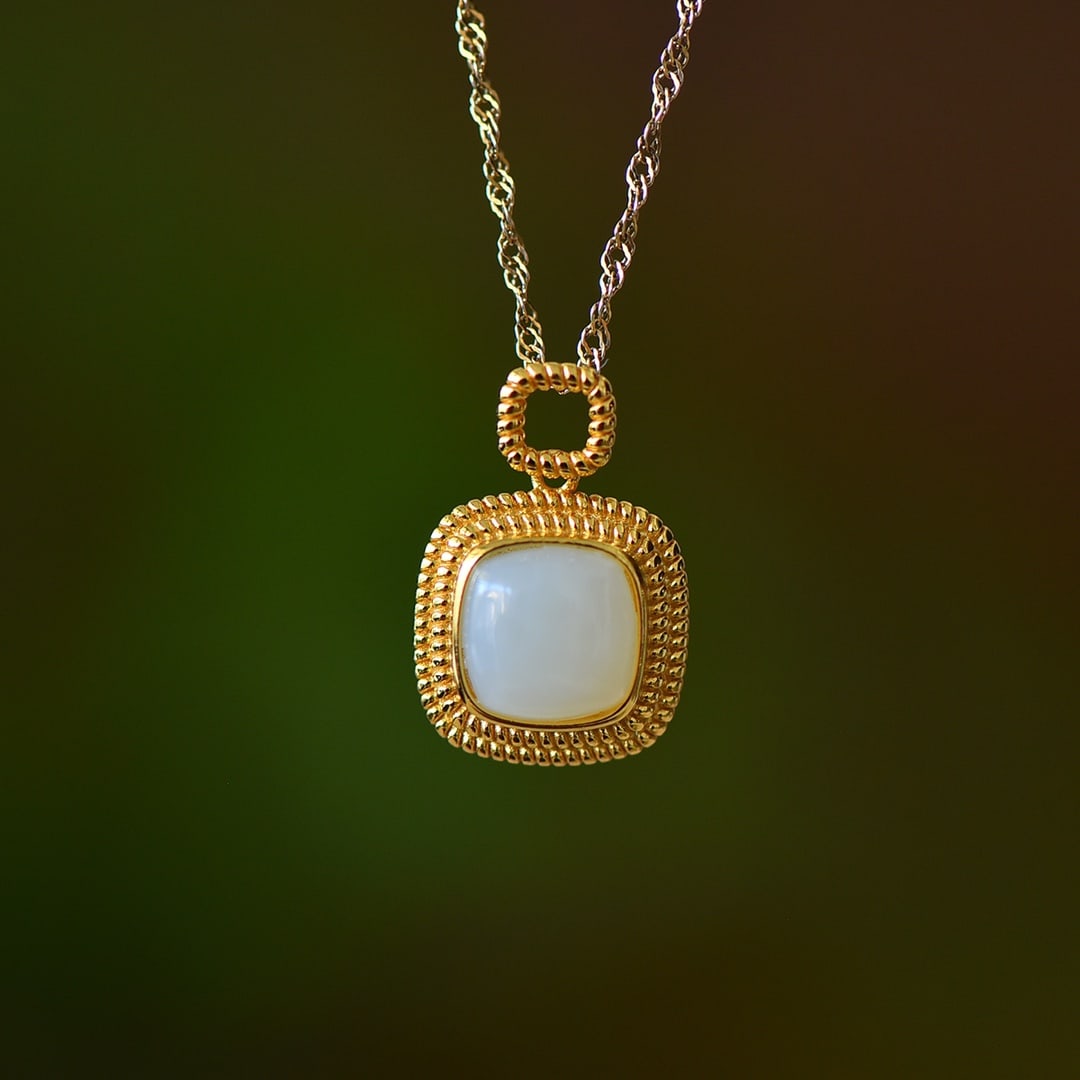 An Exquisite Sterling Silver-Gold Plated Inlaid White Jade Pendant: An Exquisite Sterling Silver-Gold Plated Inlaid White Jade Pendant,Size:0.3inx0.3in 纯银镀金镶白玉吊坠