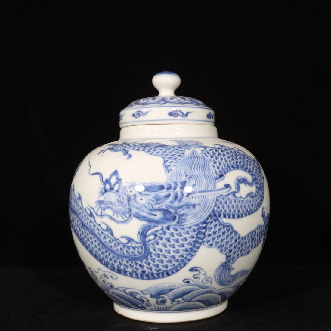 An Exquisite Blue and White Seawater,Auspicious Cloud and Dragon Pattern Cover Jar: An Exquisite Blue and White Seawater,Auspicious Cloud and Dragon Pattern Cover Jar,Ming Dynasty, China,Xuande Six-character Mark,Size:7.1inx6.1in 青花海水祥云࿵