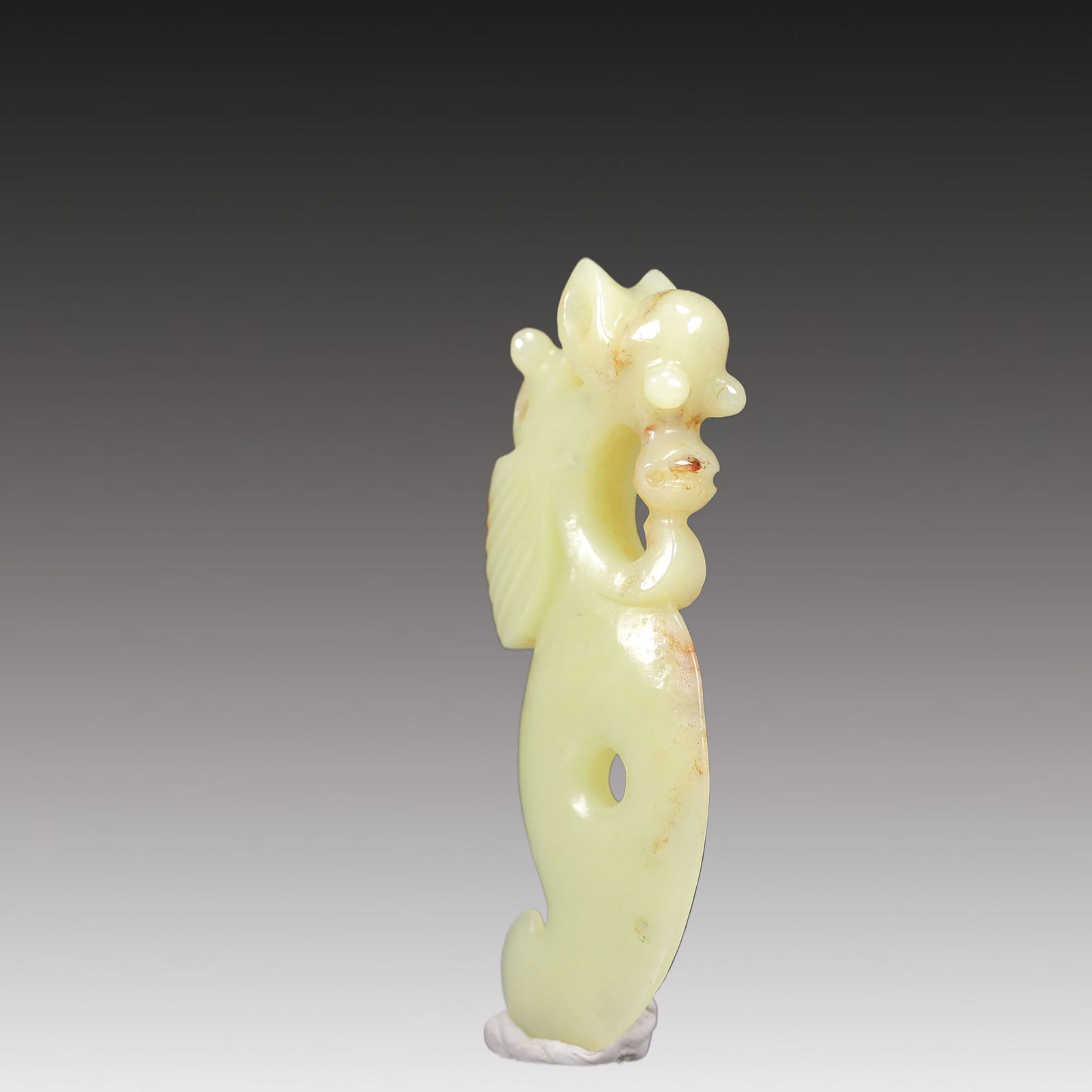 A Rare White Jade Auspicious Beast Pendant (1 of 18)
