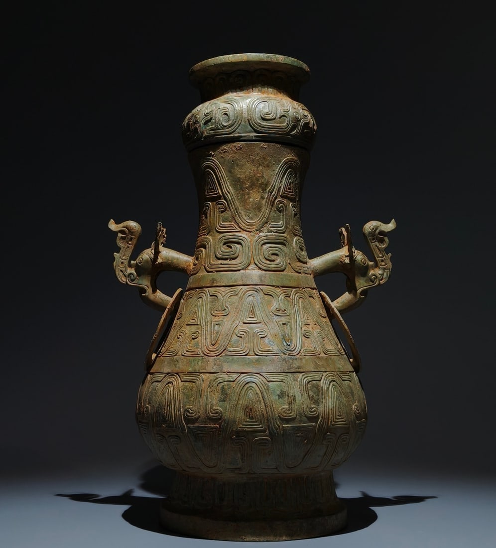 An Archaic Bronze Beast-Ears Pot: An Archaic Bronze Beast-Ears Pot,the Western Zhou Dynasty in China,Size:18.1inx11.8inx8.7in 青铜兽耳壶,中国西周时期