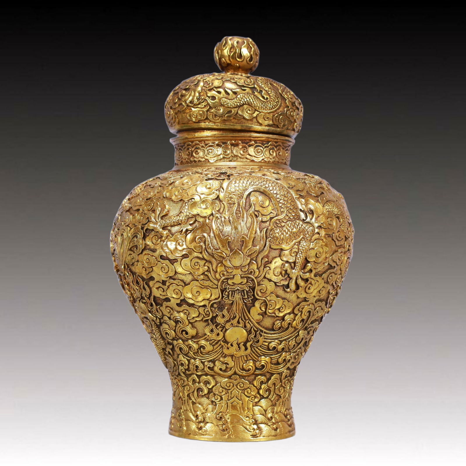 A Rare Gilt Bronze Auspicious Cloud and Dragon Pattern Cover Jar: A Rare Gilt Bronze Auspicious Cloud and Dragon Pattern Cover Jar,Qing Dynasty, China,Qianlong Six-character Mark,Size:6.7inx11.4in,Weight:2650g 铜鎏金祥云龙纹