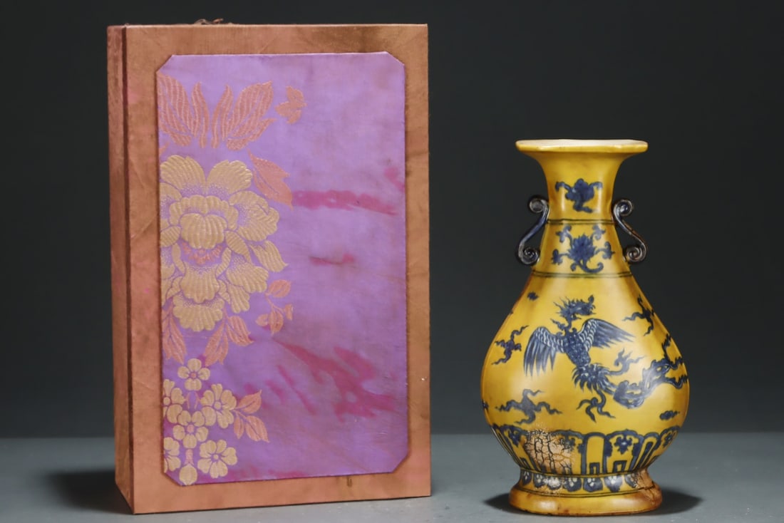 An Exquisite Yellow Ground Blue and White Auspicious Cloud and Phoenix Pattern Double-Ears Vase: An Exquisite Yellow Ground Blue and White Auspicious Cloud and Phoenix Pattern Double-Ears Vase,Ming Dynasty, China,Zhengde Six-character Mark,Size:10.5inx6.1in 黄地青花祥