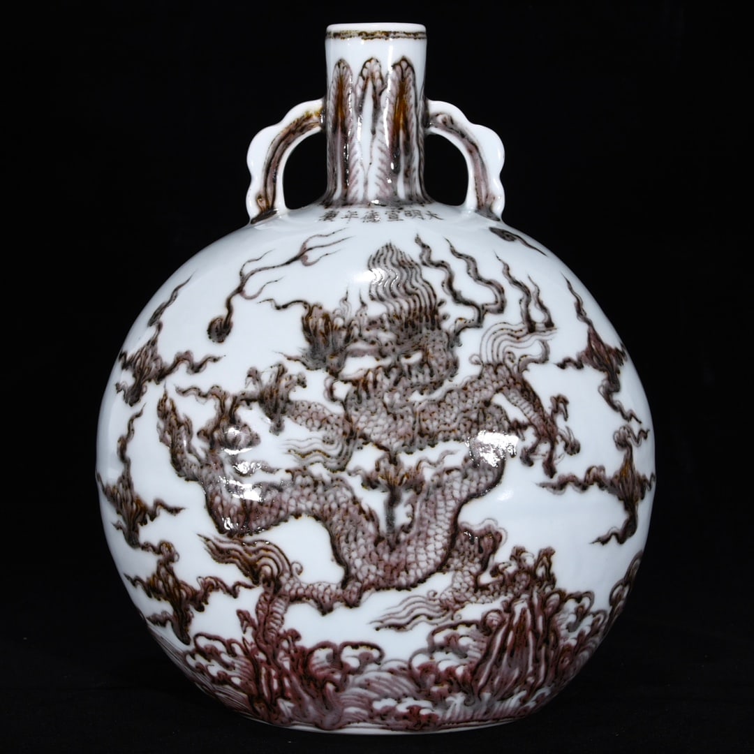 An Exquisite Underglaze-Red Seawater,Auspicious Cloud and Dragon Pattern Double-Ears Vase: An Exquisite Underglaze-Red Seawater,Auspicious Cloud and Dragon Pattern Double-Ears Vase,Ming Dynasty, China,Xuande Six-character Mark,Size:11inx8.7in 釉里红海水祥