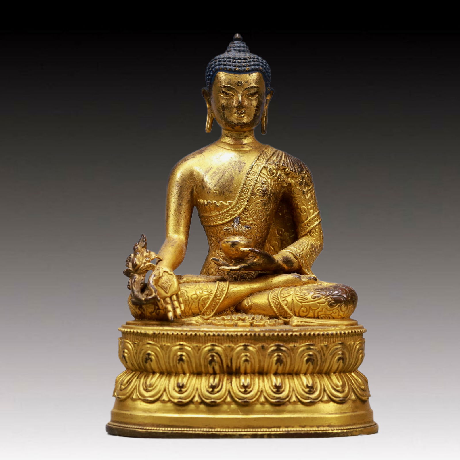 A Solemn Gilt Bronze Statue of Sakyamuni: A Solemn Gilt Bronze Statue of Sakyamuni,Qing Dynasty, China,Size:3.1inx2inx4.9inWeight:300g 铜鎏金释迦牟尼像,中国清代