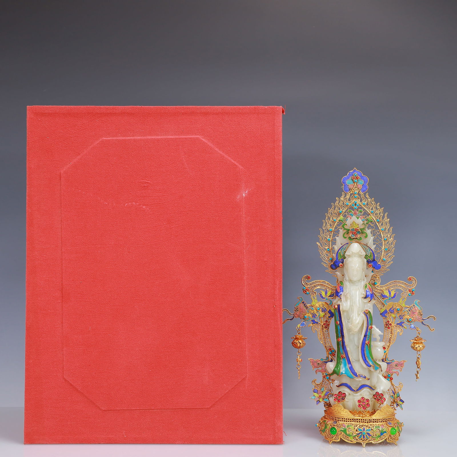 An Exquisite Filigree and Gilding Inlaid White Jade Statue of Avalokitesvara,Inlaid Turquoise: An Exquisite Filigree and Gilding Inlaid White Jade Statue of Avalokitesvara,Inlaid Turquoise,Qing Dynasty, China,Qianlong Four-Character Mark,Size:7.9inx3.5inx13.8in,(Box)16.5inx12.6inx5.9in,Weight:1