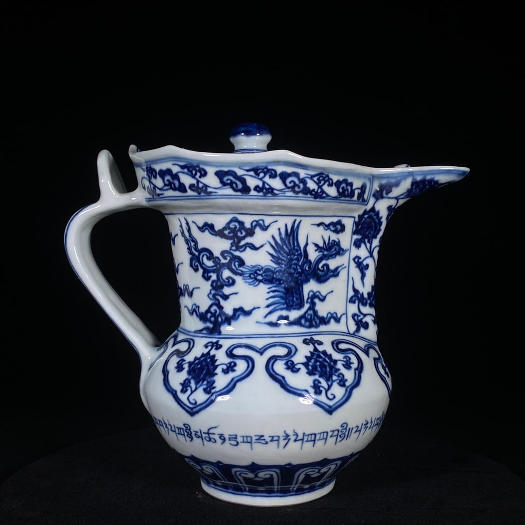 An Exquisite Blue and White Lotus,Auspicious Cloud and Phoenix Pattern Ewer,With Sanskrit: An Exquisite Blue and White Lotus,Auspicious Cloud and Phoenix Pattern Ewer,With Sanskrit,Ming Dynasty, China,Xuande Six-character Mark,Size:8.3inx9.1in 青花缠枝莲祥