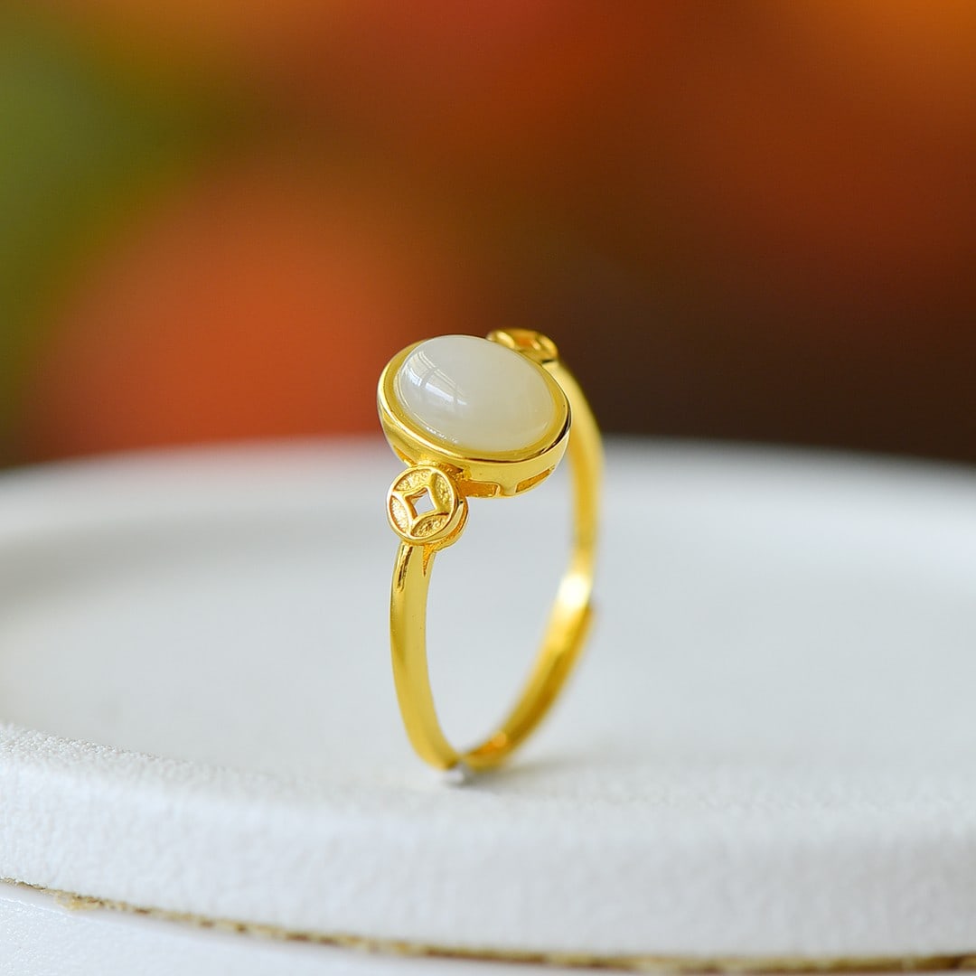An Exquisite Sterling Silver-Gold Plated Inlaid White Jade Ring: An Exquisite Sterling Silver-Gold Plated Inlaid White Jade Ring,Size:6mmx8mm 纯银镀金镶白玉戒指
