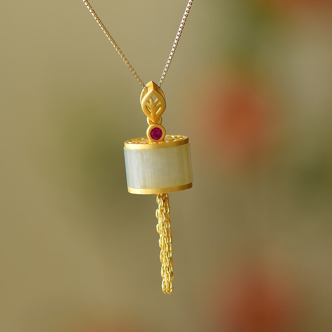 An Exquisite Sterling Silver-Gold Plated Inlaid White Jade Pendant: An Exquisite Sterling Silver-Gold Plated Inlaid White Jade Pendant,Size:7mmx12mm 纯银镀金镶白玉吊坠