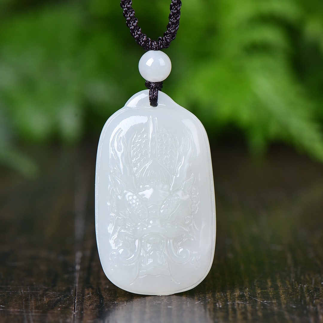An Exquisite White Jade Auspicious Cloud and Dragon Pattern Pendant: An Exquisite White Jade Auspicious Cloud and Dragon Pattern Pendant,Size:38mmx23mm 白玉祥云龙纹吊坠