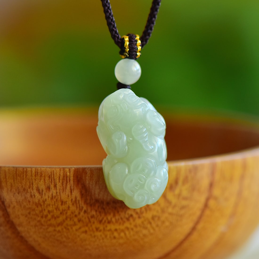 An Exquisite Greenish Jade Auspicious Beast Pendant: An Exquisite Greenish Jade Auspicious Beast Pendant,Size:27mmx15mm 寓意:貔貅是个招财宝物,钱和貔貅在一