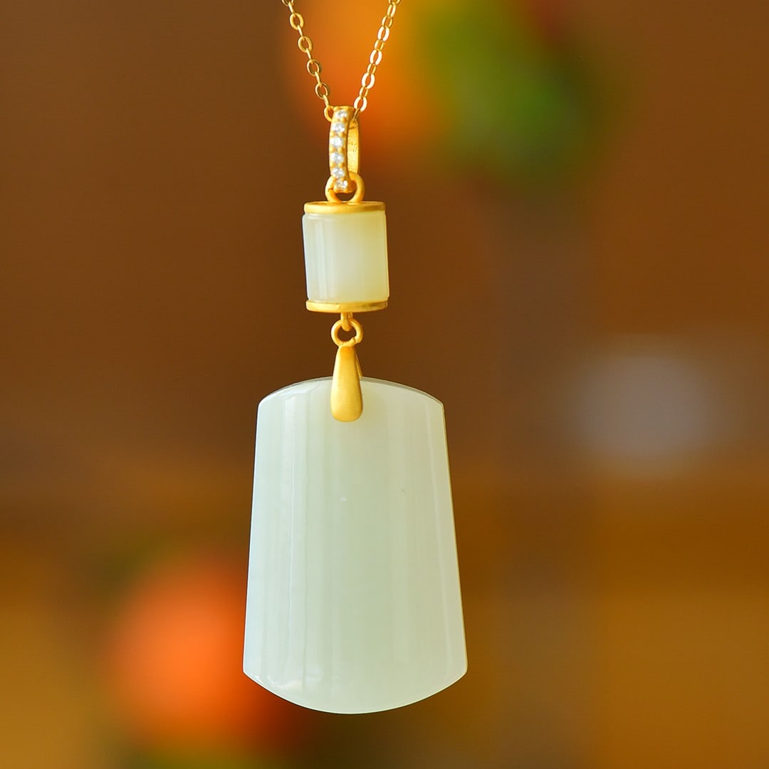 An Exquisite Sterling Silver-Gold Plated Inlaid White Jade Pendant: An Exquisite Sterling Silver-Gold Plated Inlaid White Jade Pendant 纯银镀金镶白玉吊坠