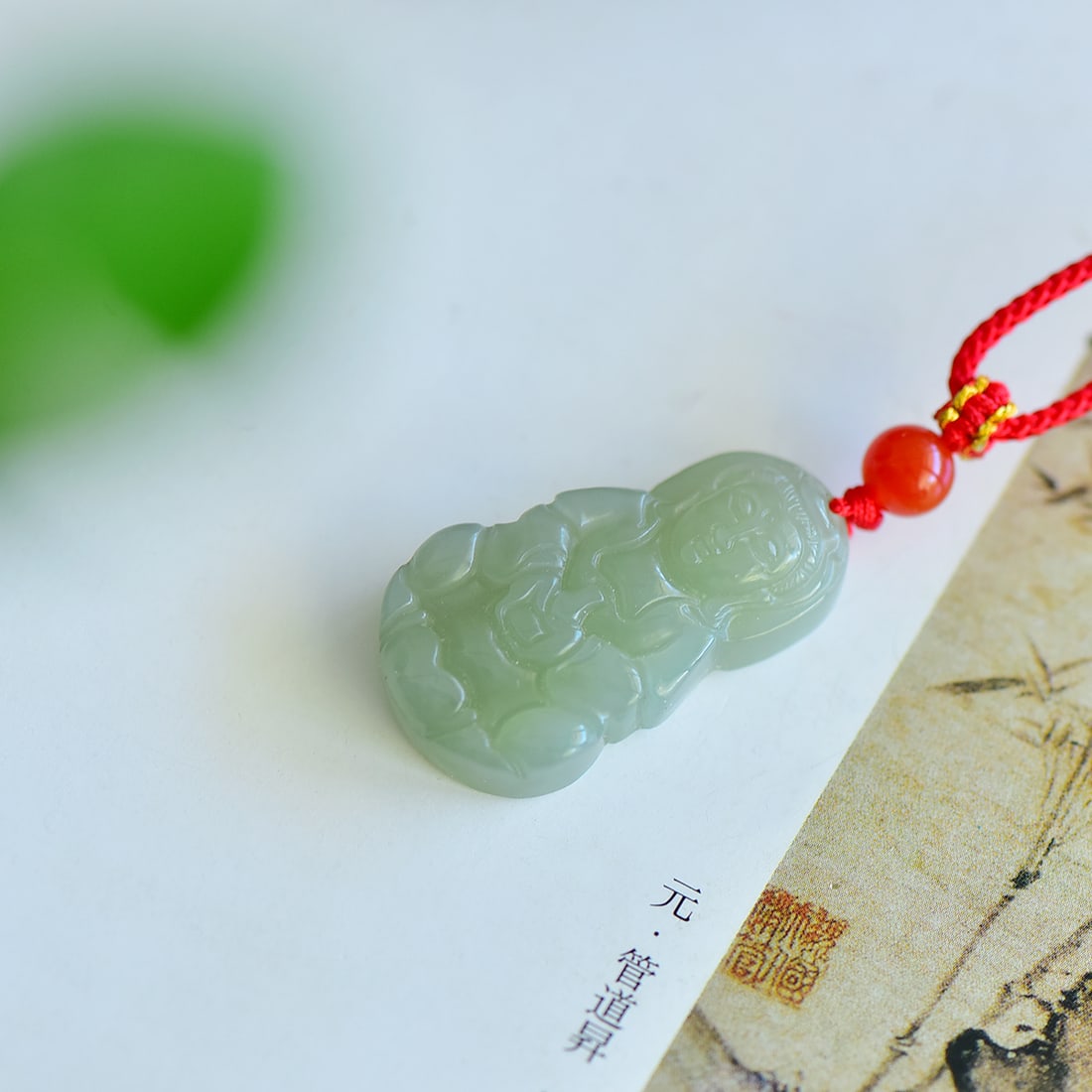 An Exquisite Greenish Jade Avalokitesvara Pendant: An Exquisite Greenish Jade Avalokitesvara Pendant,Size: 35mmx21mm 寓意:吉祥 报平安 玉质温润 款式独特 青&