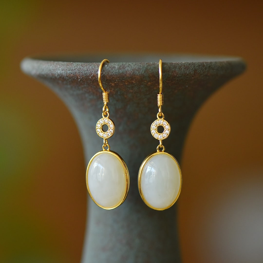 A Pair of Exquisite Sterling Silver-Gold Plated Inlaid White Jade Earrings: A Pair of Exquisite Sterling Silver-Gold Plated Inlaid White Jade Earrings,Size:10mmx14mm 一对纯银镀金镶白玉耳环