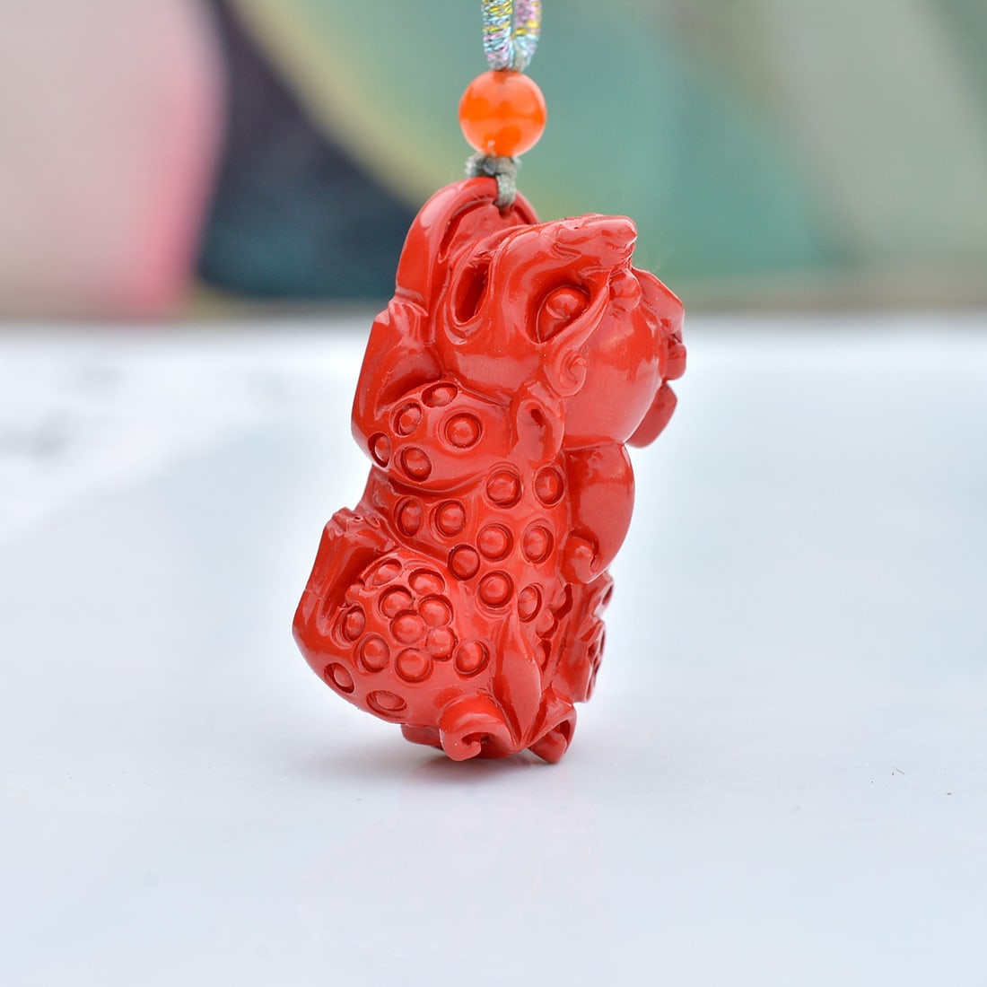 An Exquisite Cinnabar Auspicious Beast Pendant: An Exquisite Cinnabar Auspicious Beast Pendant,Size:15mmx27mm (寓意)吉祥招财喜庆、驱邪避凶、安神明