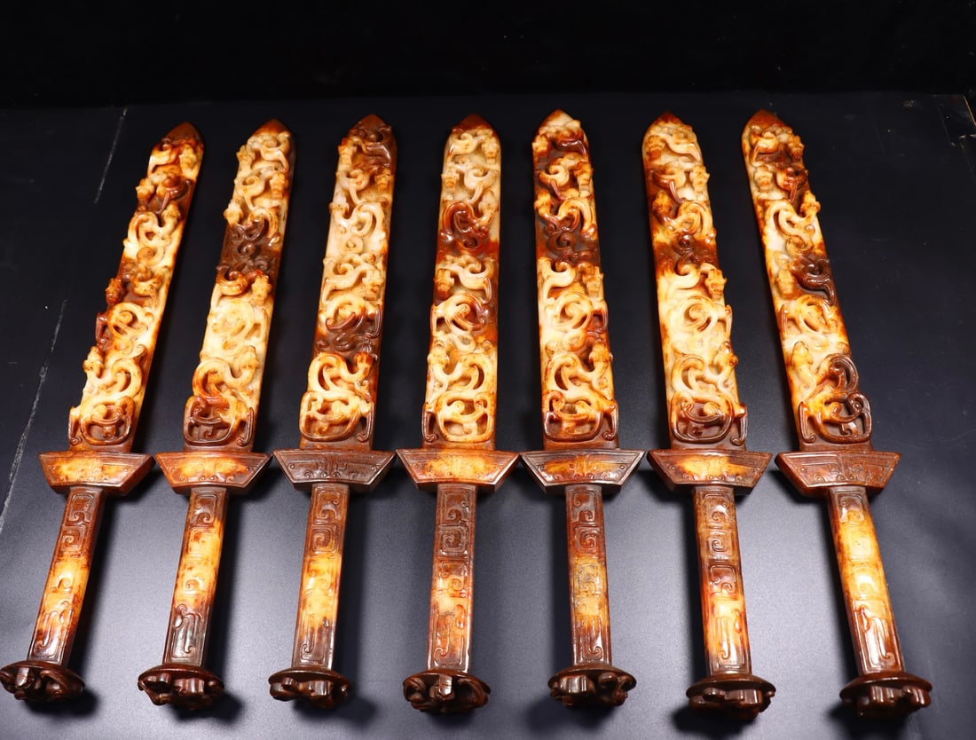A Set of Huge White Jade Auspicious Beast Pattern Swords: A Set of Huge White Jade Auspicious Beast Pattern Swords,Qing Dynasty, China,Size:23.8inx3.3inx2.6in,Weight:1126g*7 