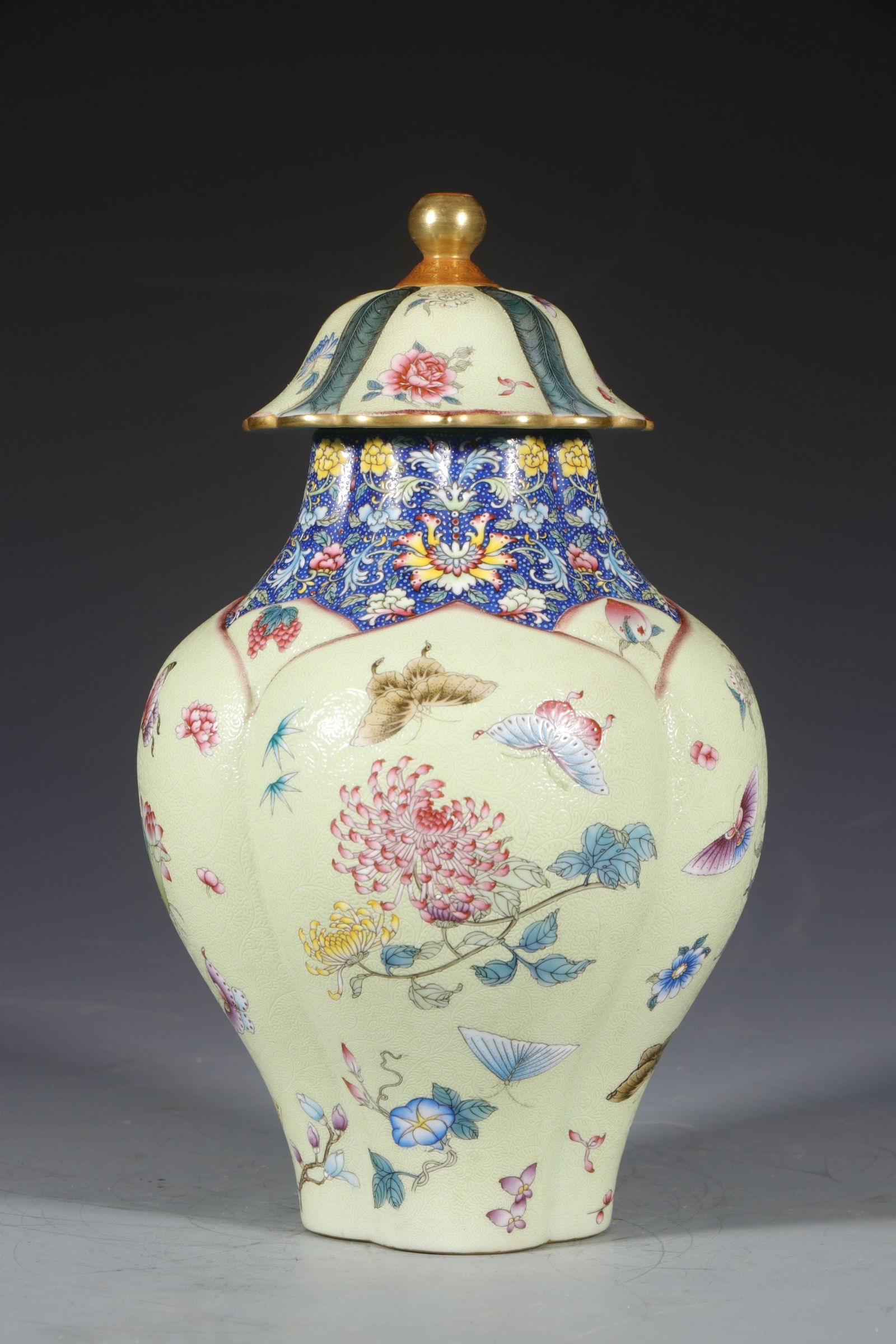An Exquisite Yellow Ground Enamel Flower and Butterfly Pattern Tea Caddy: An Exquisite Yellow Ground Enamel Flower and Butterfly Pattern Tea Caddy,Qing Dynasty,China,Qianlong Four-character Mark,Size:10.6inx3.1in 黄地珐琅彩花卉Ś
