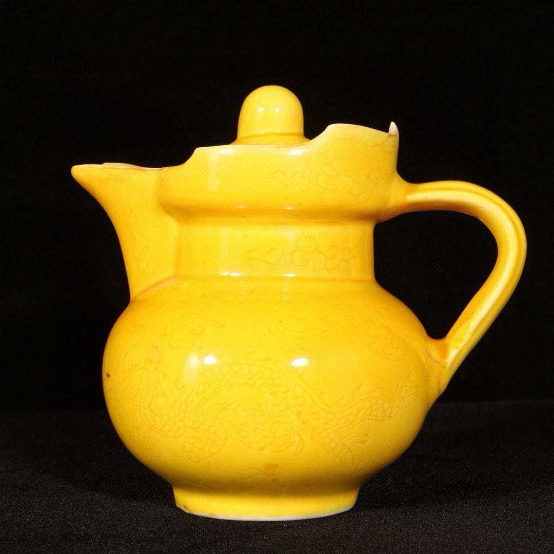 An Exquisite Yellow Glazed Dragon Pattern Pot: An Exquisite Yellow Glazed Dragon Pattern Pot,Ming Dynasty,China,Chenghua Six-character Mark,Size:4.7inx4.9in 黄釉龙纹壶,中国明代,成化