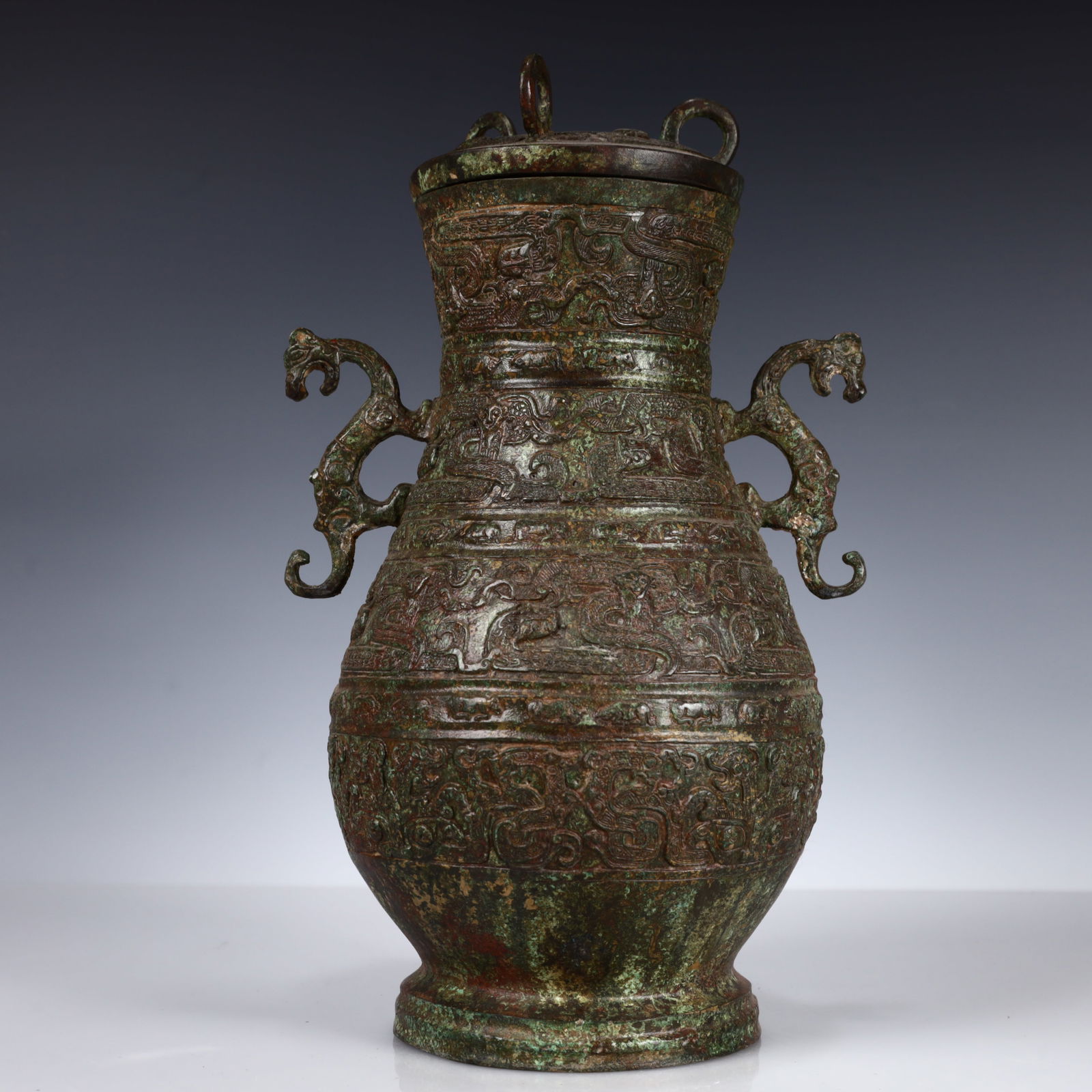 A Rare Bronze Dragon-Ears Bottle: A Rare Bronze Dragon-Ears Bottle,W.Zhou,China,Size:7.9inx6.7inx13in,Weight:3150g 青铜龙耳瓶带盖,中国西周时期