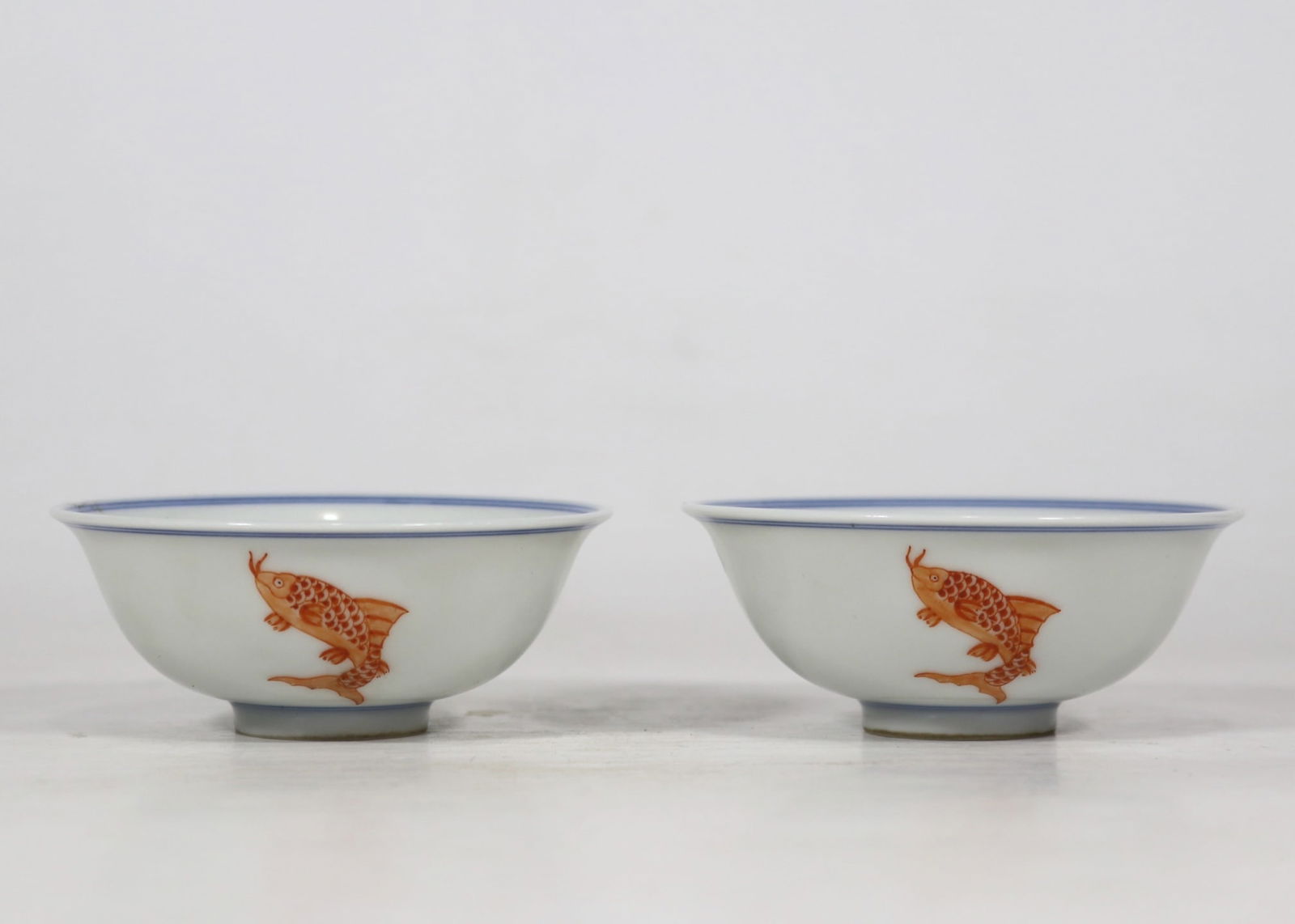 A Pair of Exquisite Blue and White Jiacai Fish Pattern Cups: A Pair of Exquisite Blue and White Jiacai Fish Pattern Cups,Qing Dynasty,China,Yongzheng Six-character Mark,Size:3.3inx1.4ins 一对青花加彩鱼纹杯,&