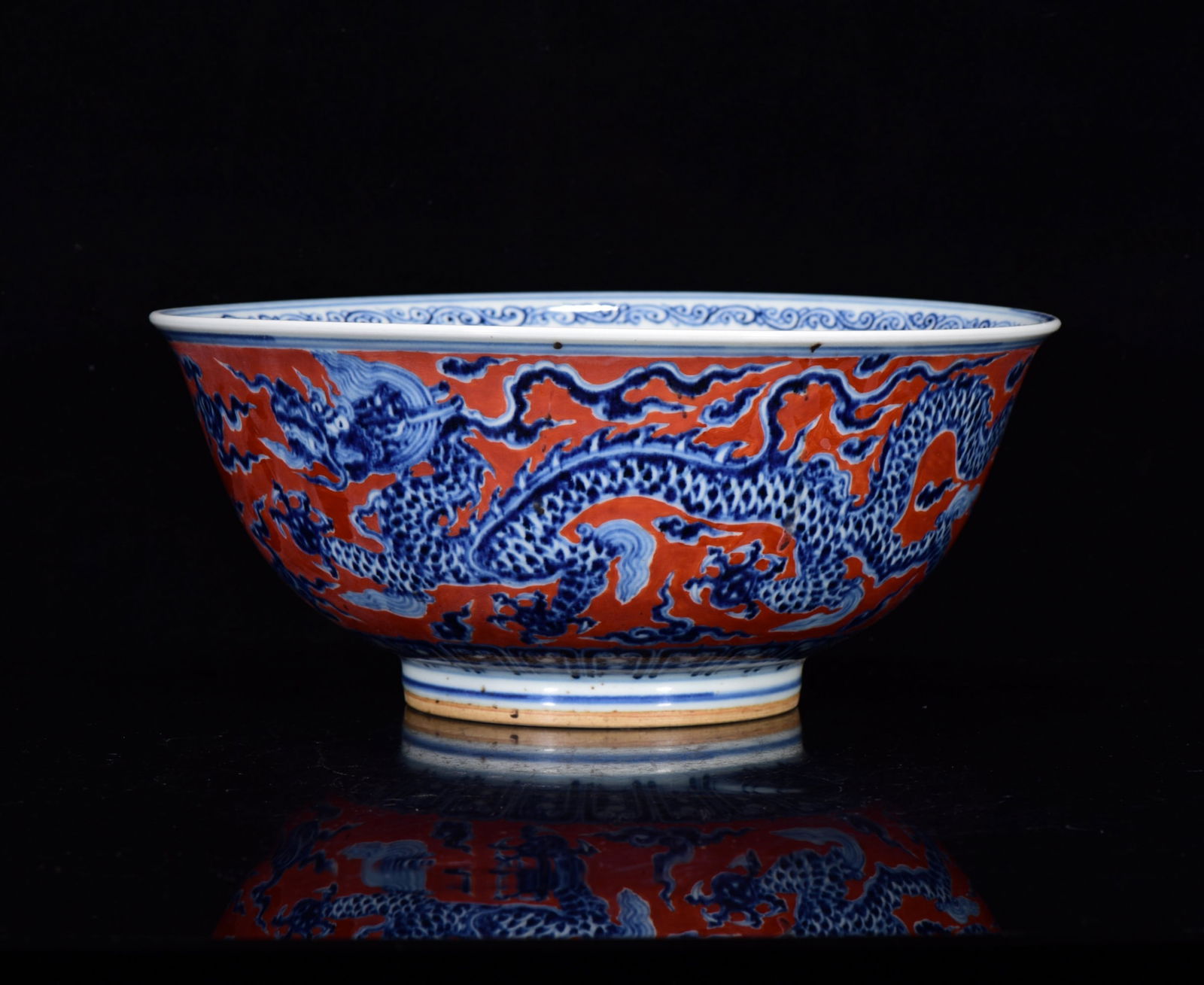 An Exquisite Ruby Red-Glazed Blue and White Auspicious Cloud and Dragon Pattern Bowl: An Exquisite Ruby Red-Glazed Blue and White Auspicious Cloud and Dragon Pattern Bowl,Ming Dynasty,China,Xuande Six-character Mark,Size:5.1inx11.8in 