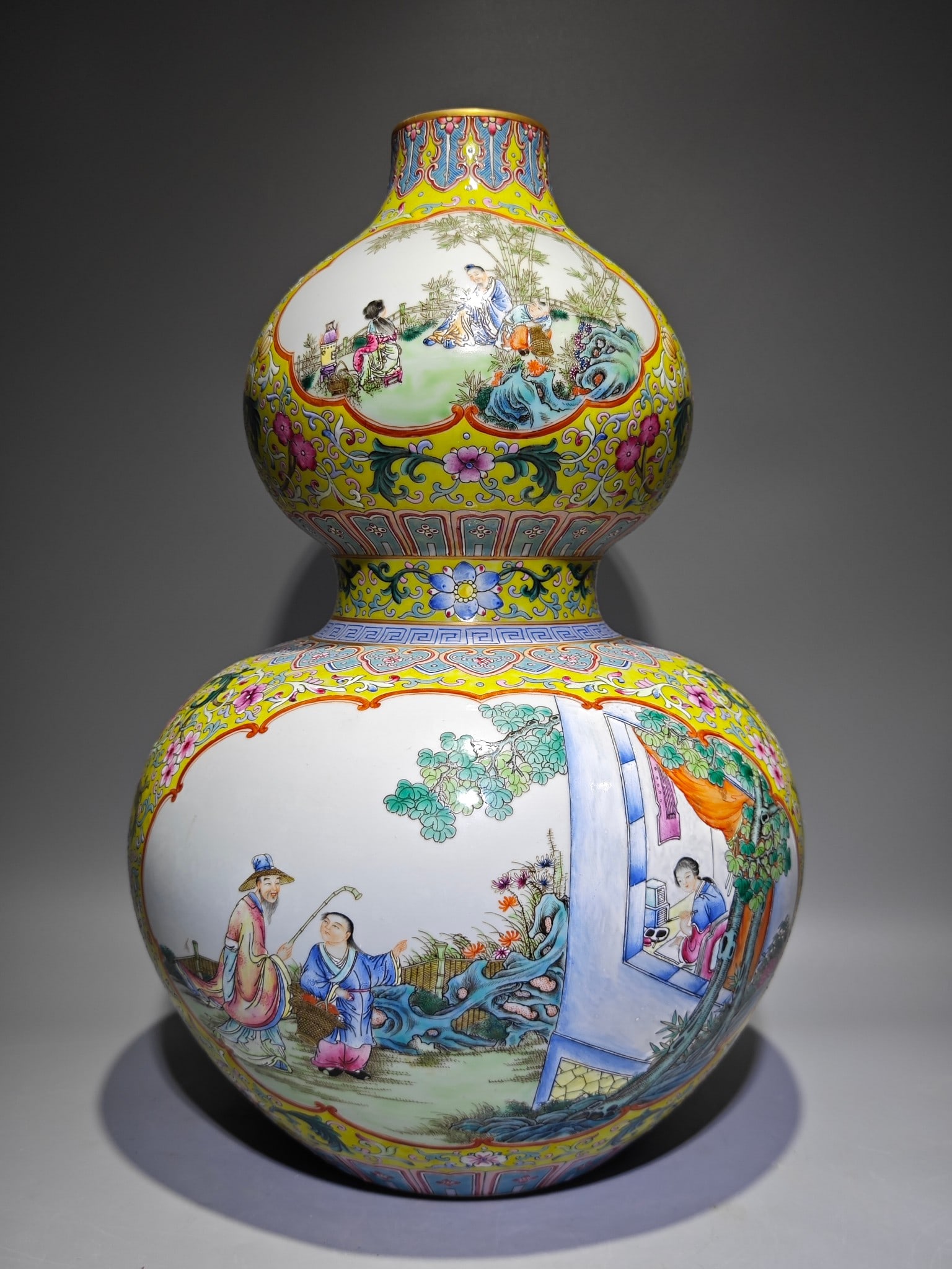An Exquisite Enamel Yellow Ground Character and Story Pattern Gourd-Shaped Vase: An Exquisite Enamel Yellow Ground Character and Story Pattern Gourd-Shaped Vase,Qing Dynasty,China,Qianlong Six-character Mark,Size:17.4inx11.8in 