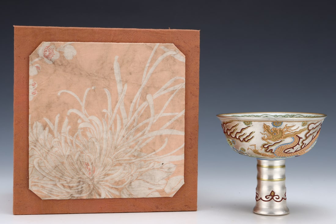 An Exquisite White Glazed Auspicious Cloud and Dragon Pattern Stem Bowl: An Exquisite White Glazed Auspicious Cloud and Dragon Pattern Stem Bowl,Yuan Dynasty,China,Size:4.8inx5.3in 白釉祥云龙纹高足碗,中国